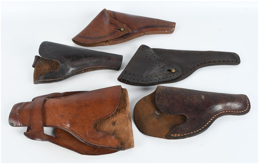 Lot 1076: A Collection of 5 Leather Handgun Holsters