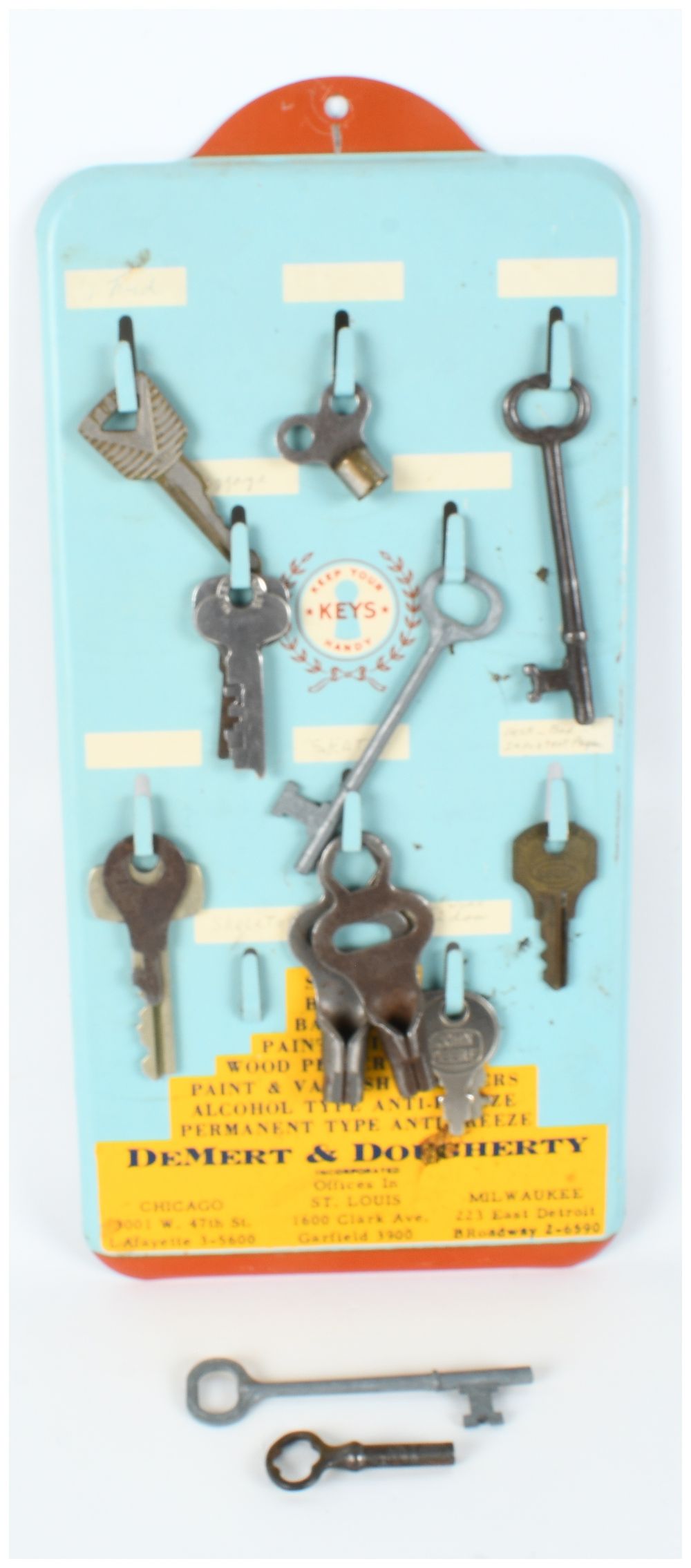 Lot 1193: DeMert and Dougherty Inc. Advertising Key Rack with an Assortment of Keys