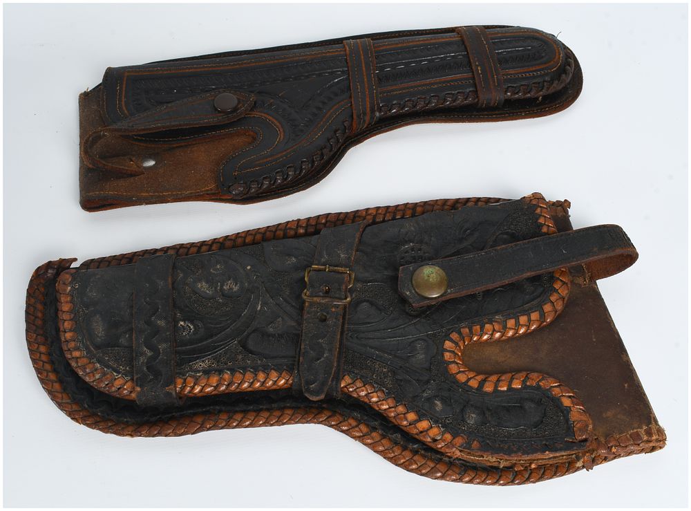 Lot 1256: A Pair of Tooled Leather Western Style Revolver Holsters