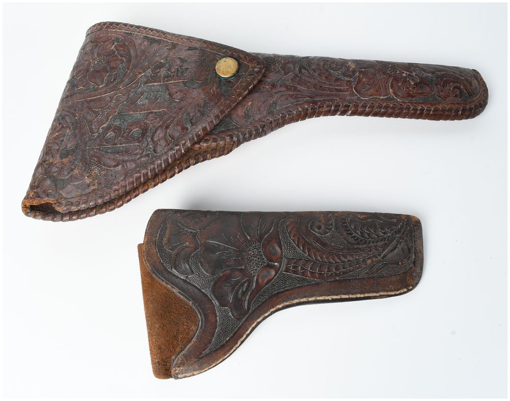 Lot 1316: A Pair of Floral Tooled Leather Holsters Attributed to H.H. Heiser