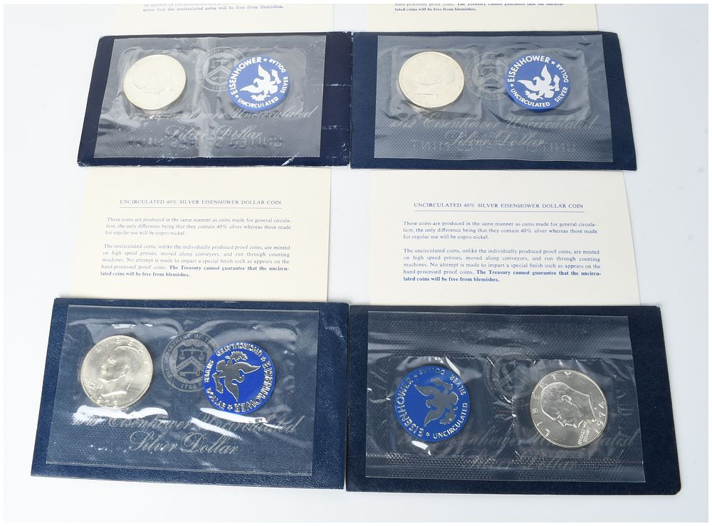 Lot 1409: A Set of Four US 1971-S through 1974-S Eisenhower Uncirculated 40% Silver Dollars in Original Blue Packets