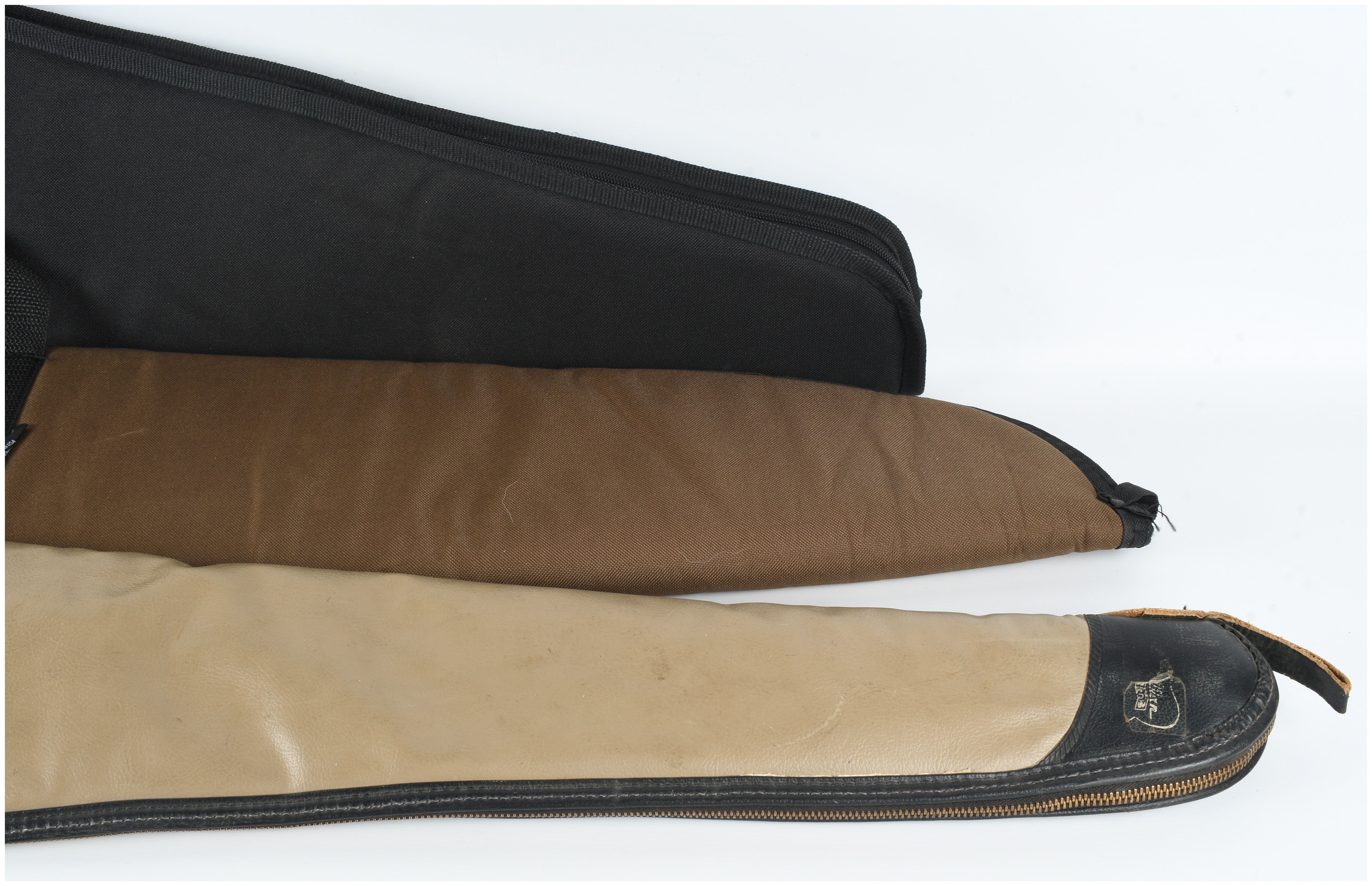 A Collection of 3 Gun Cases and Slips Including Plano and Boyt Models