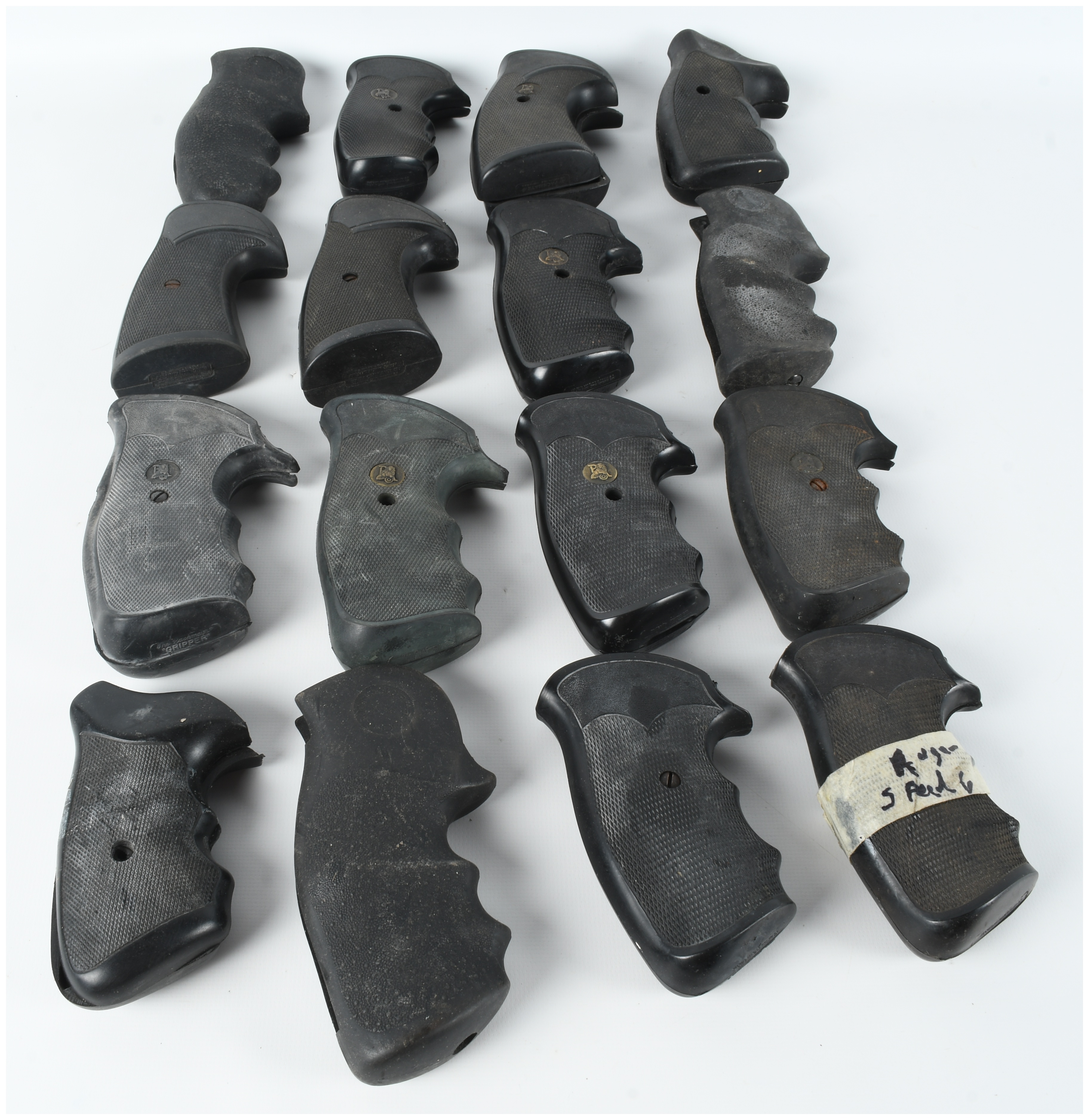 A Collection of 16 Assorted Rubber and Polymer Revolver Grips Including Pachmayr and Hogue Styles