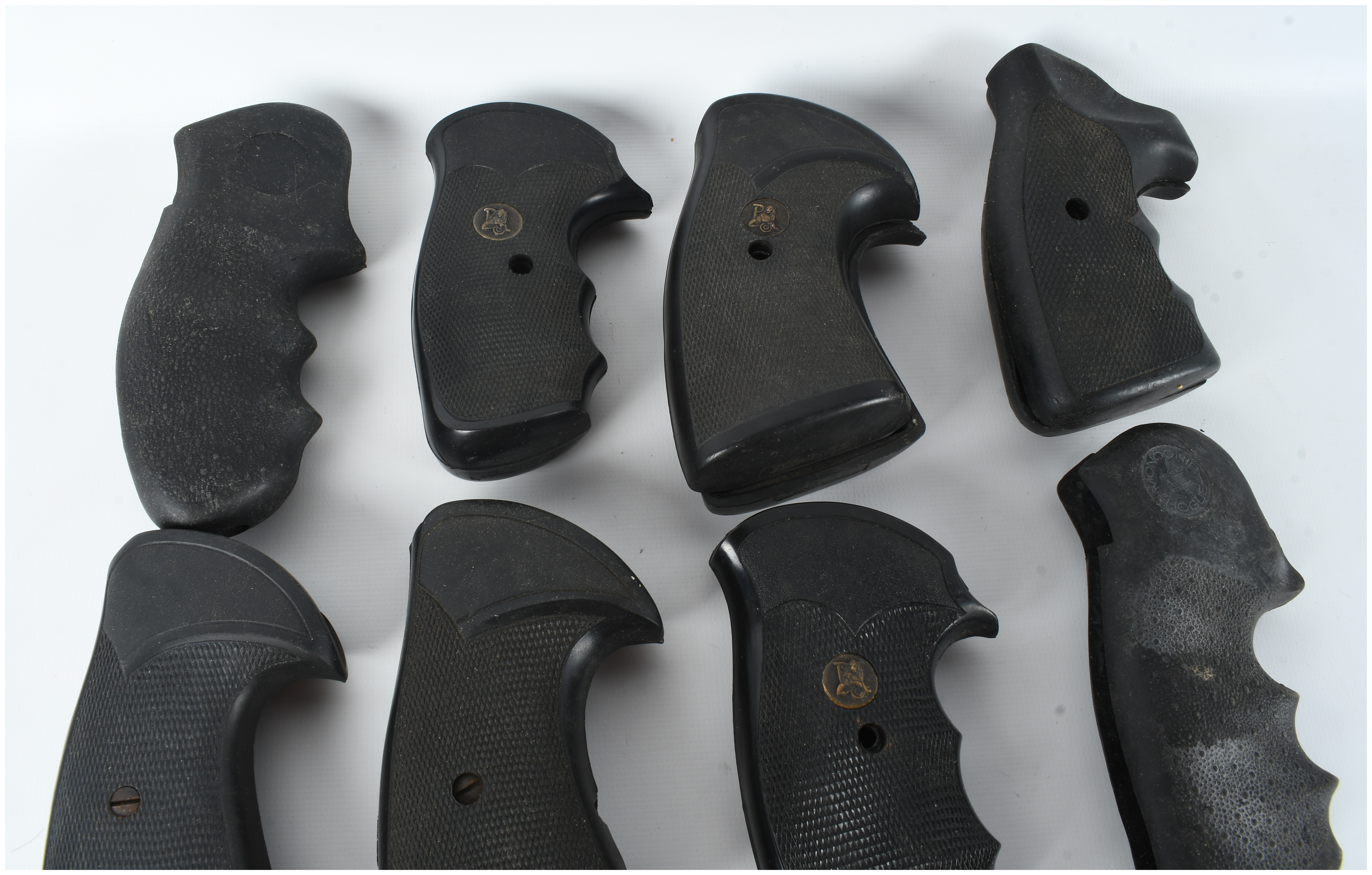 A Collection of 16 Assorted Rubber and Polymer Revolver Grips Including Pachmayr and Hogue Styles