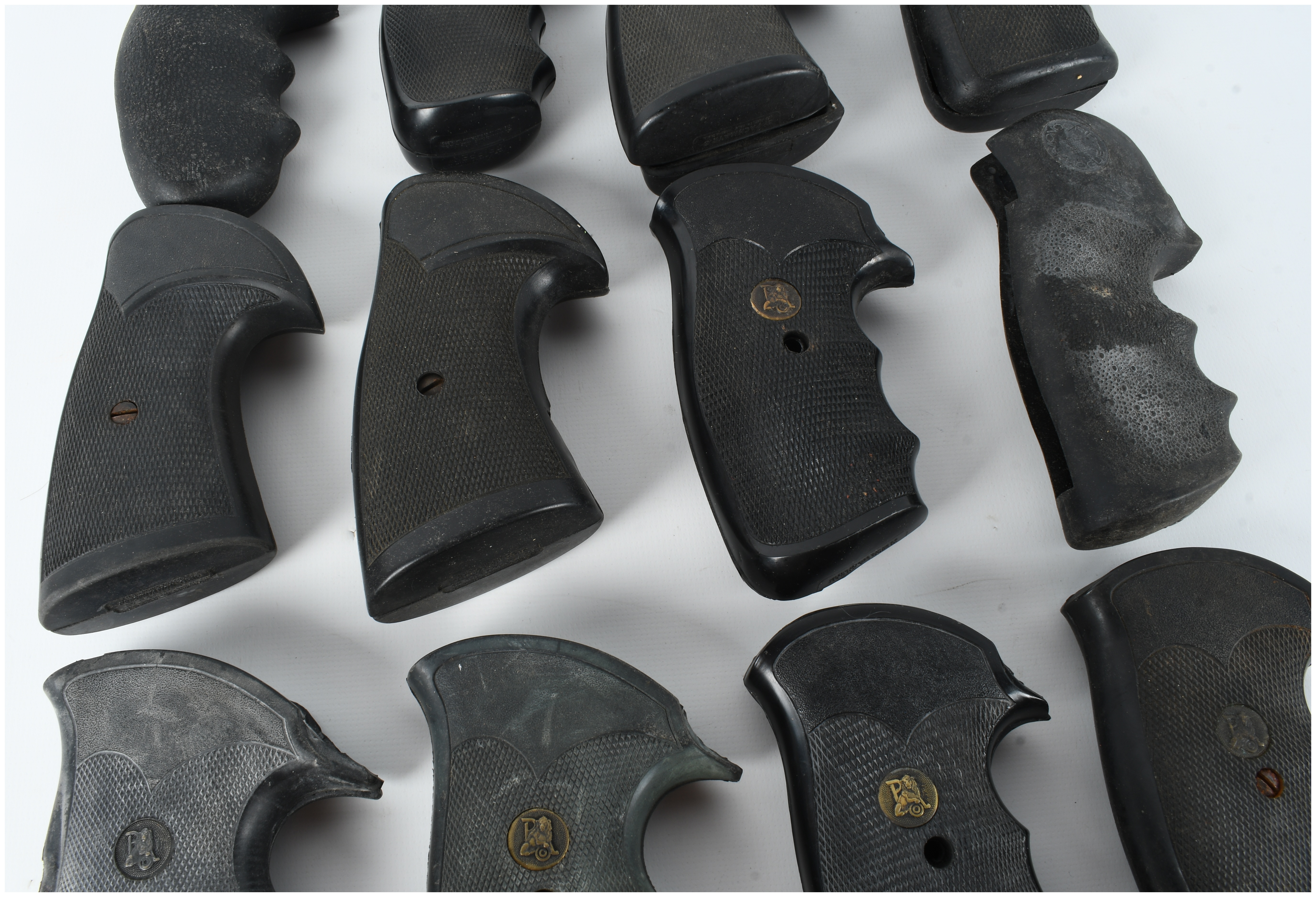A Collection of 16 Assorted Rubber and Polymer Revolver Grips Including Pachmayr and Hogue Styles