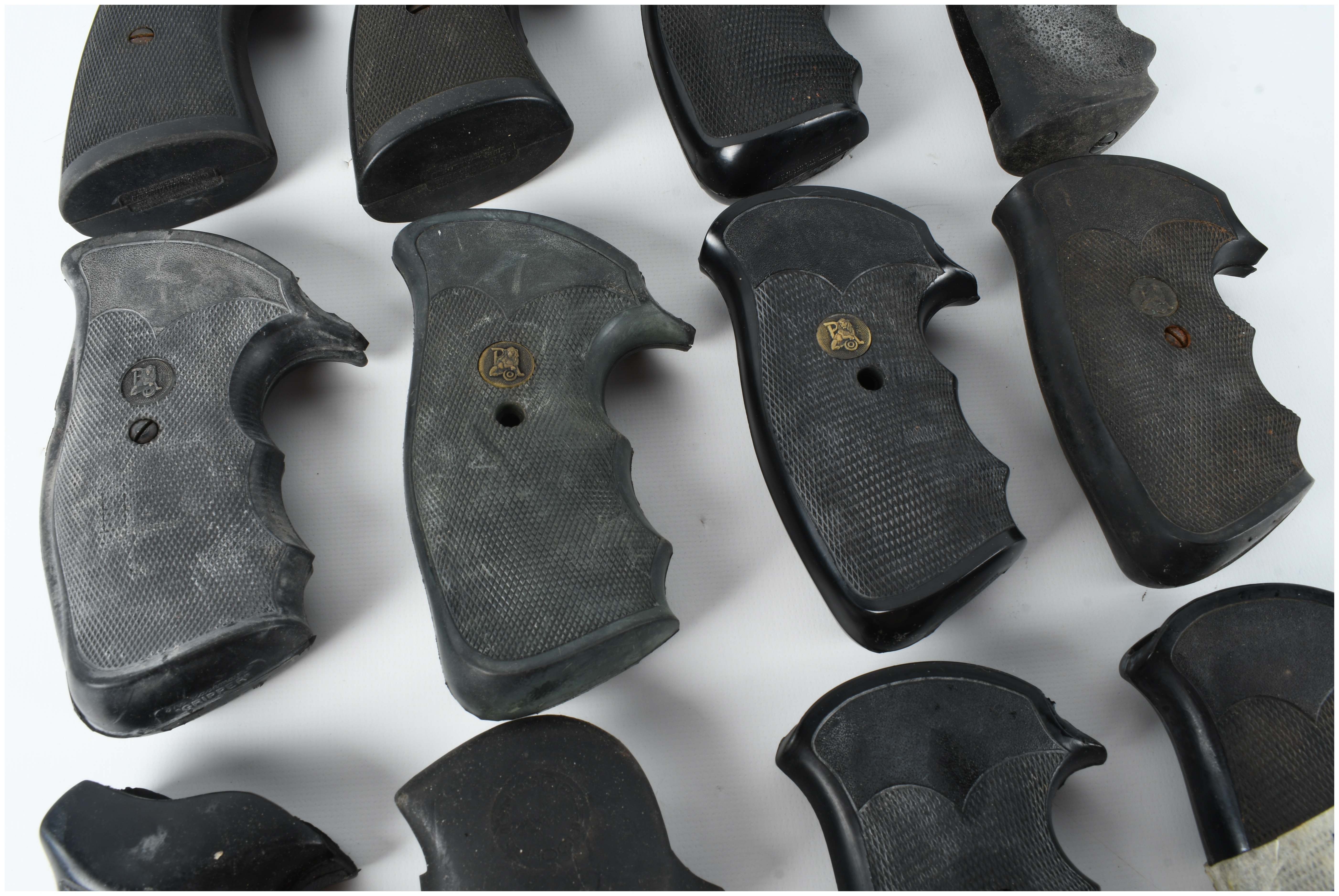 A Collection of 16 Assorted Rubber and Polymer Revolver Grips Including Pachmayr and Hogue Styles