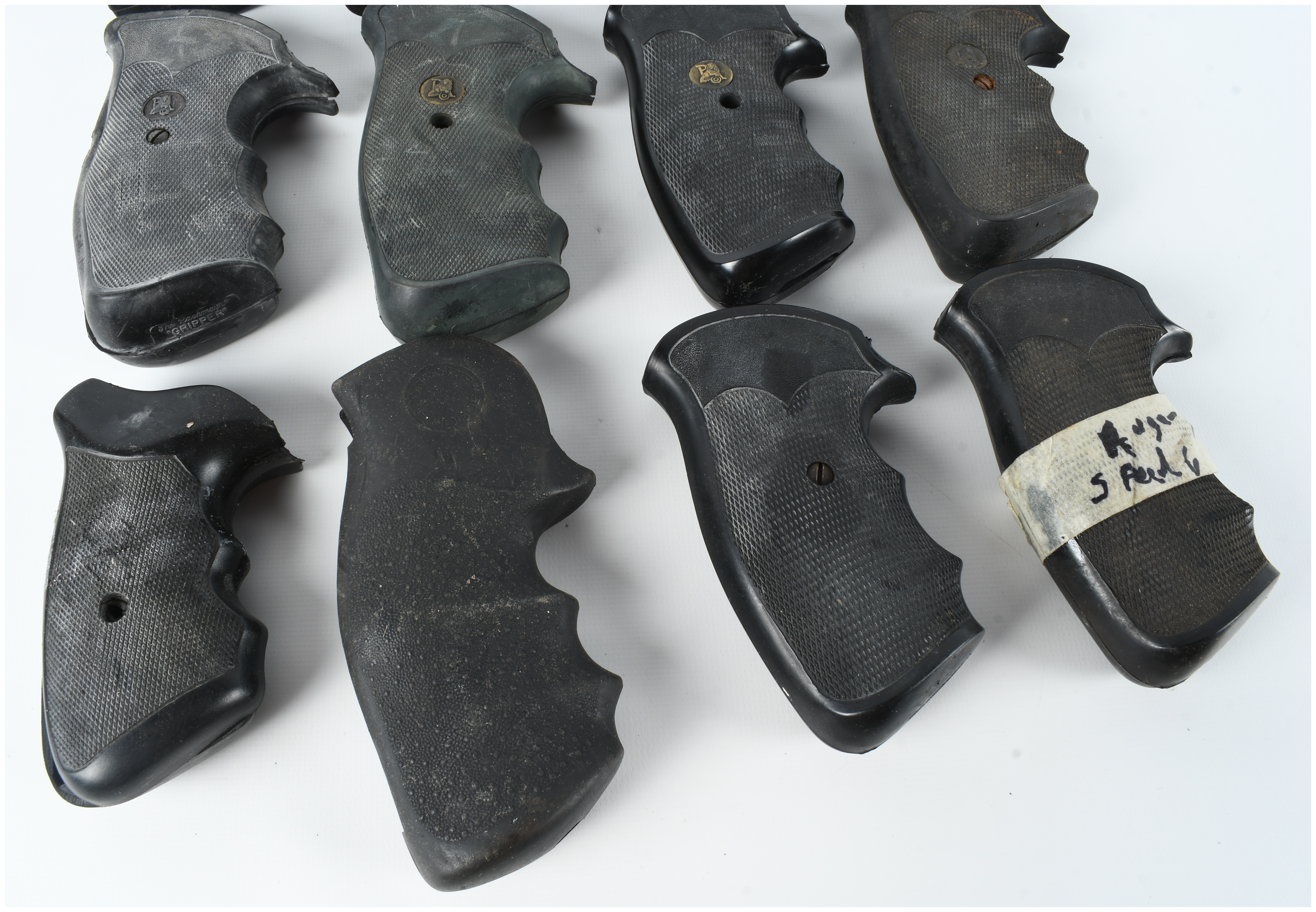 A Collection of 16 Assorted Rubber and Polymer Revolver Grips Including Pachmayr and Hogue Styles