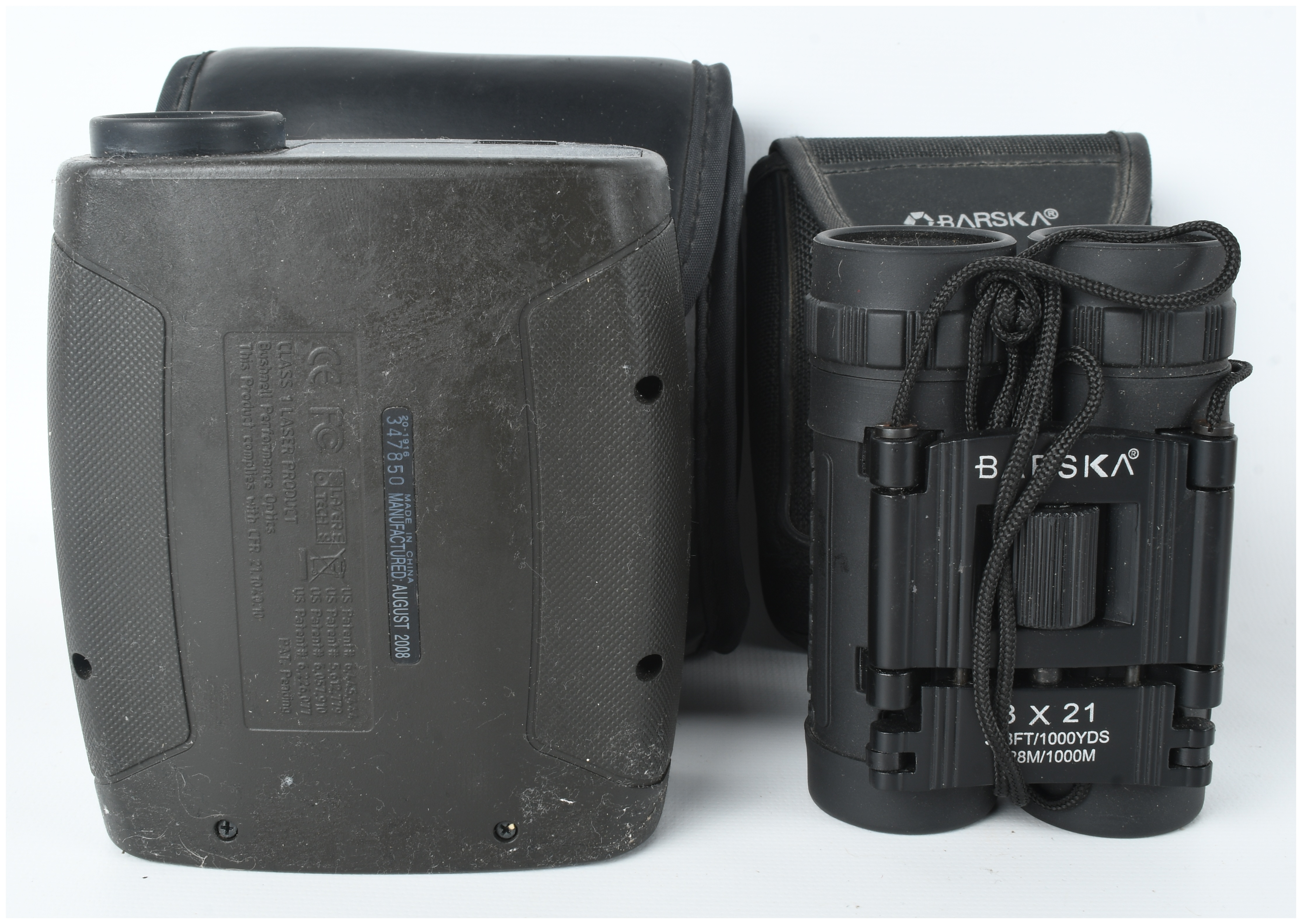 Two Optical Instruments including a Bushnell Yardage Pro Sport 450 Laser Rangefinder and Barska 8x21 Lucid View Compact Binoculars, with Cas