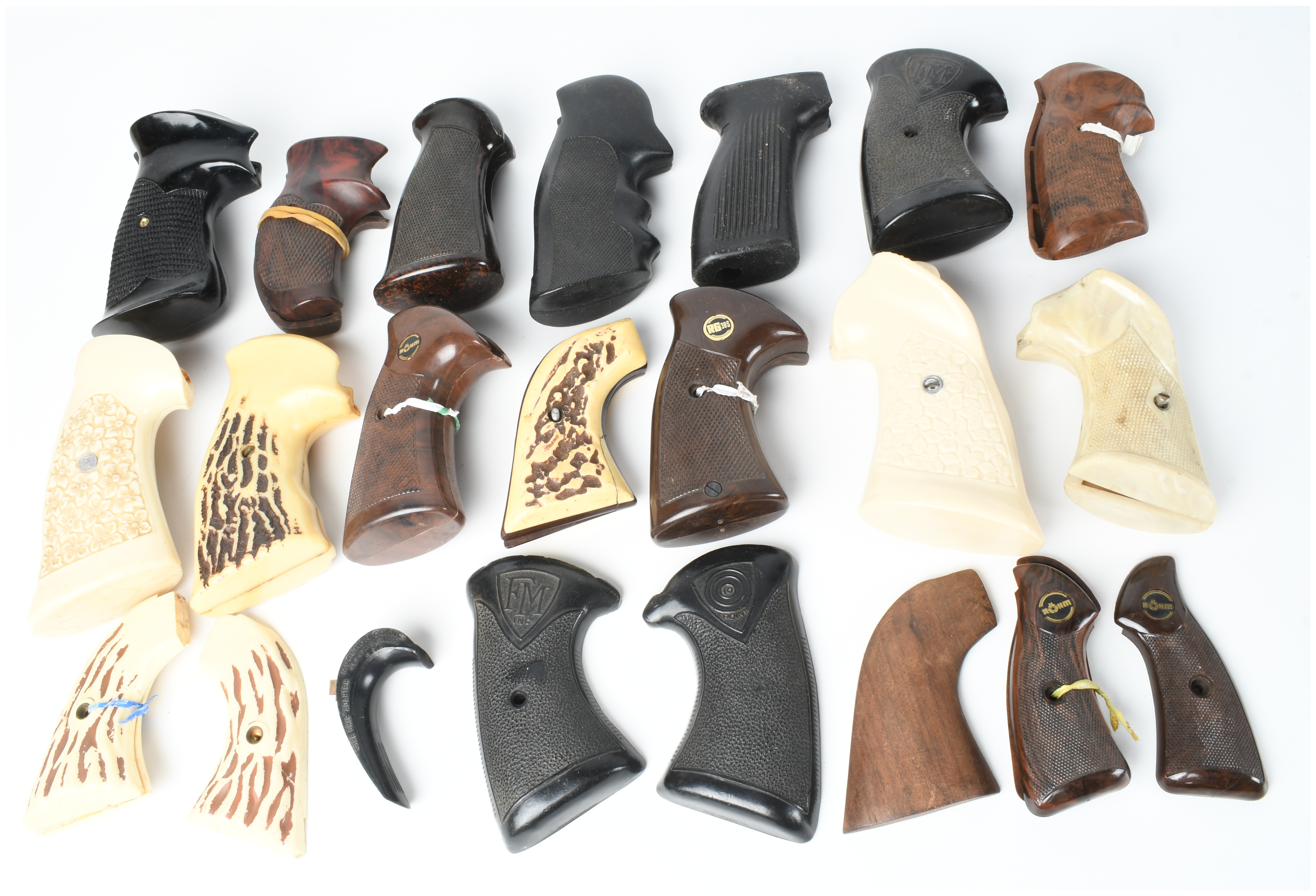 A Collection of 17 Assorted Handgun Grips and Accessories