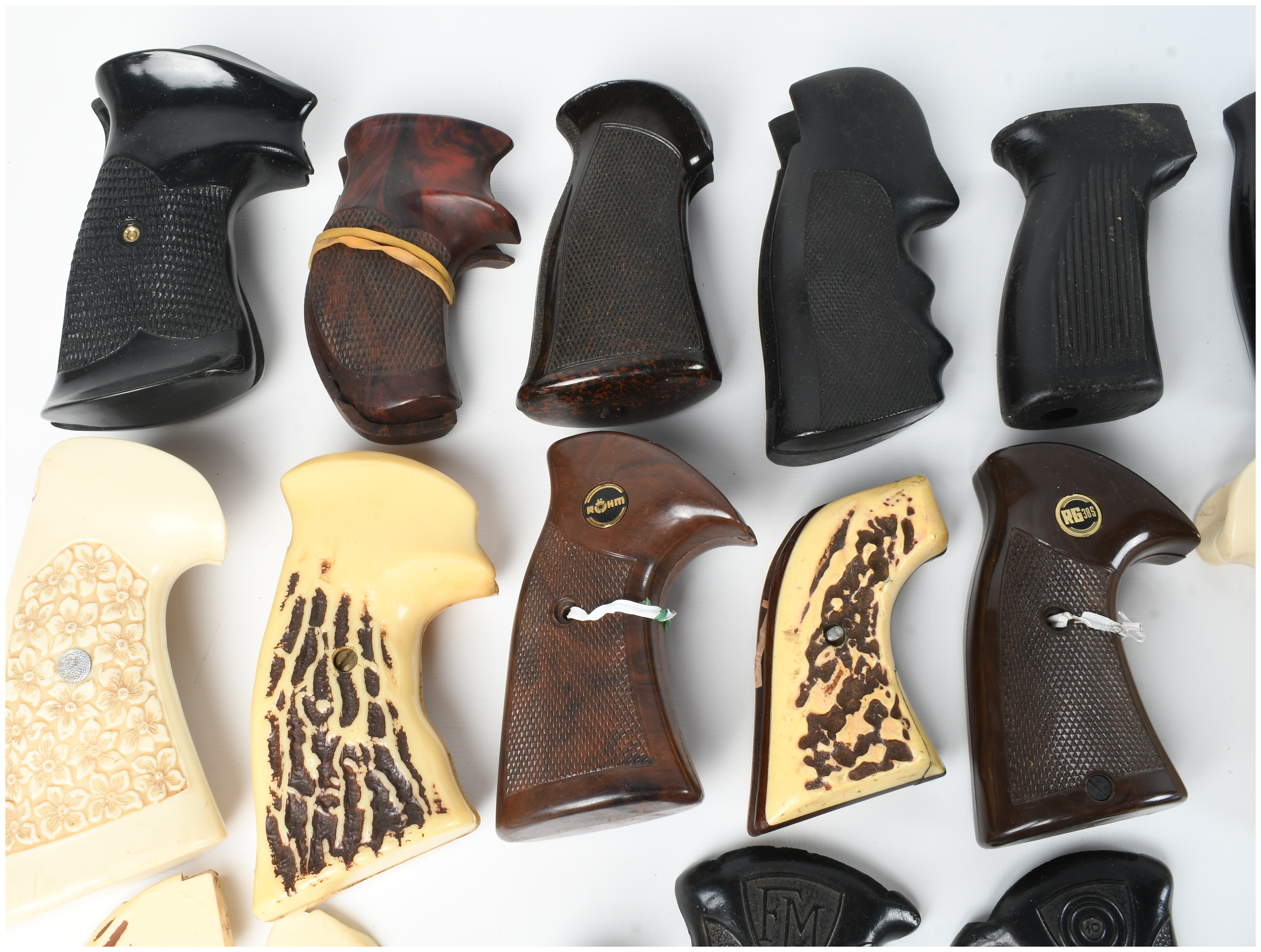 A Collection of 17 Assorted Handgun Grips and Accessories