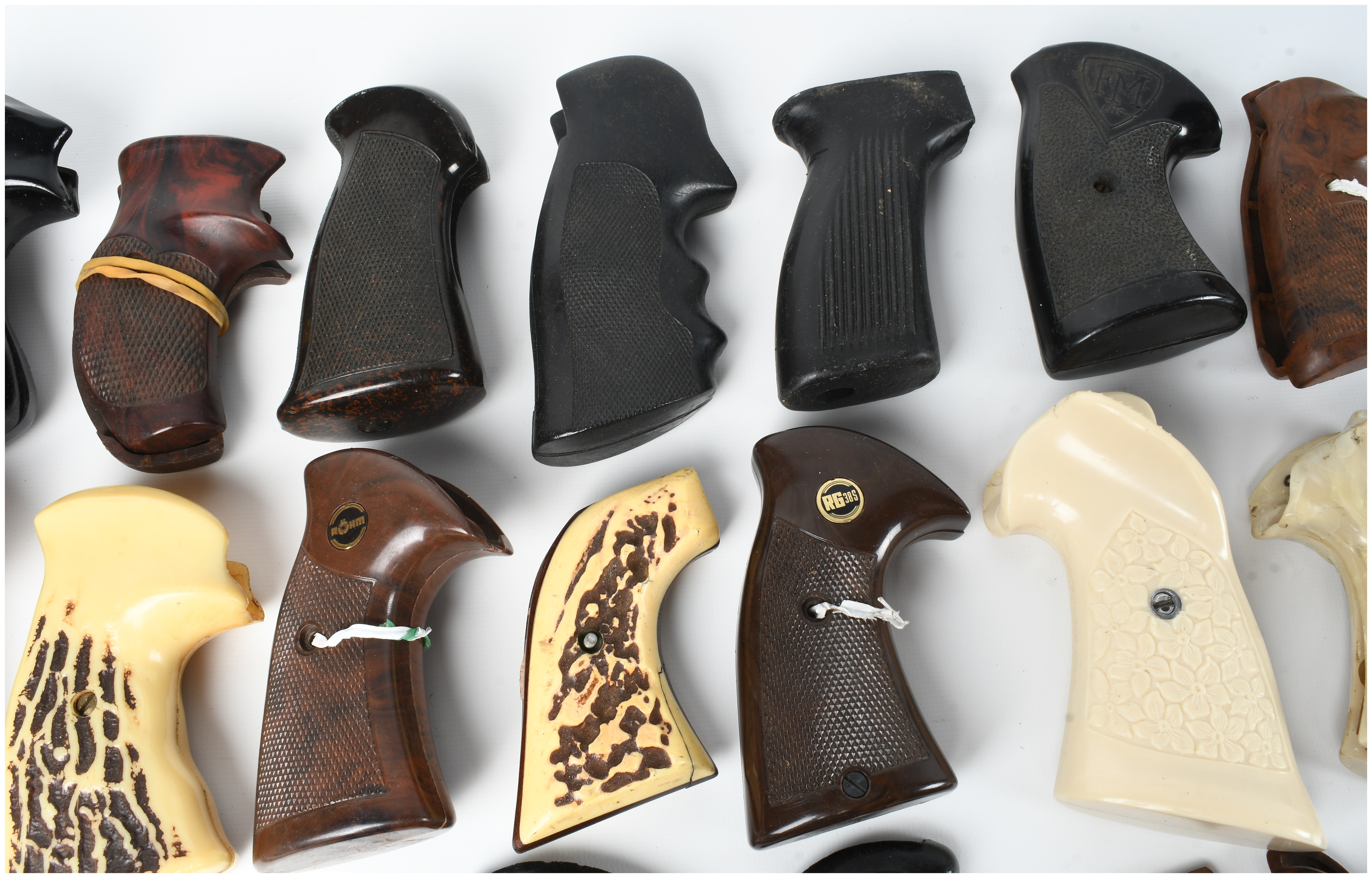 A Collection of 17 Assorted Handgun Grips and Accessories