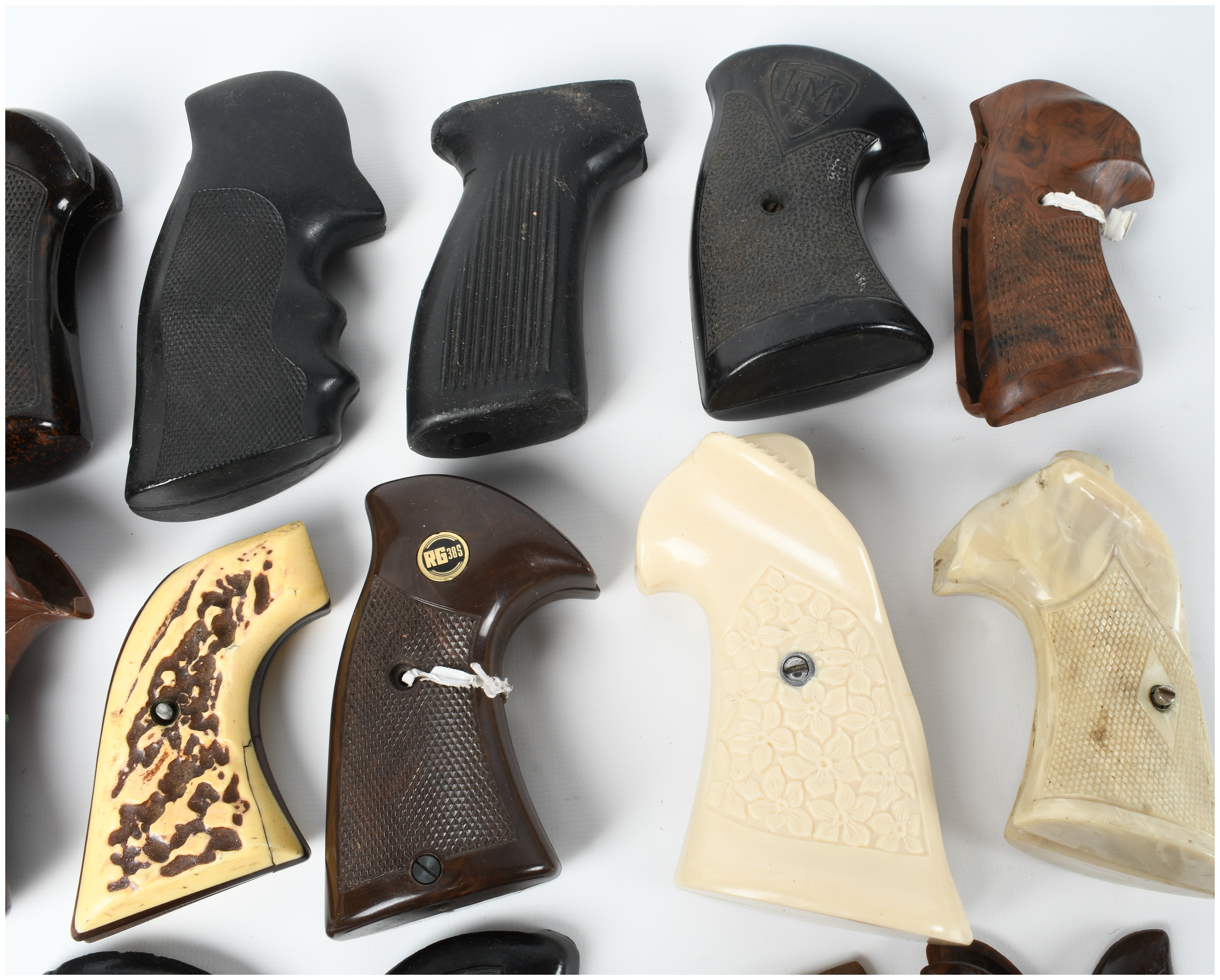 A Collection of 17 Assorted Handgun Grips and Accessories