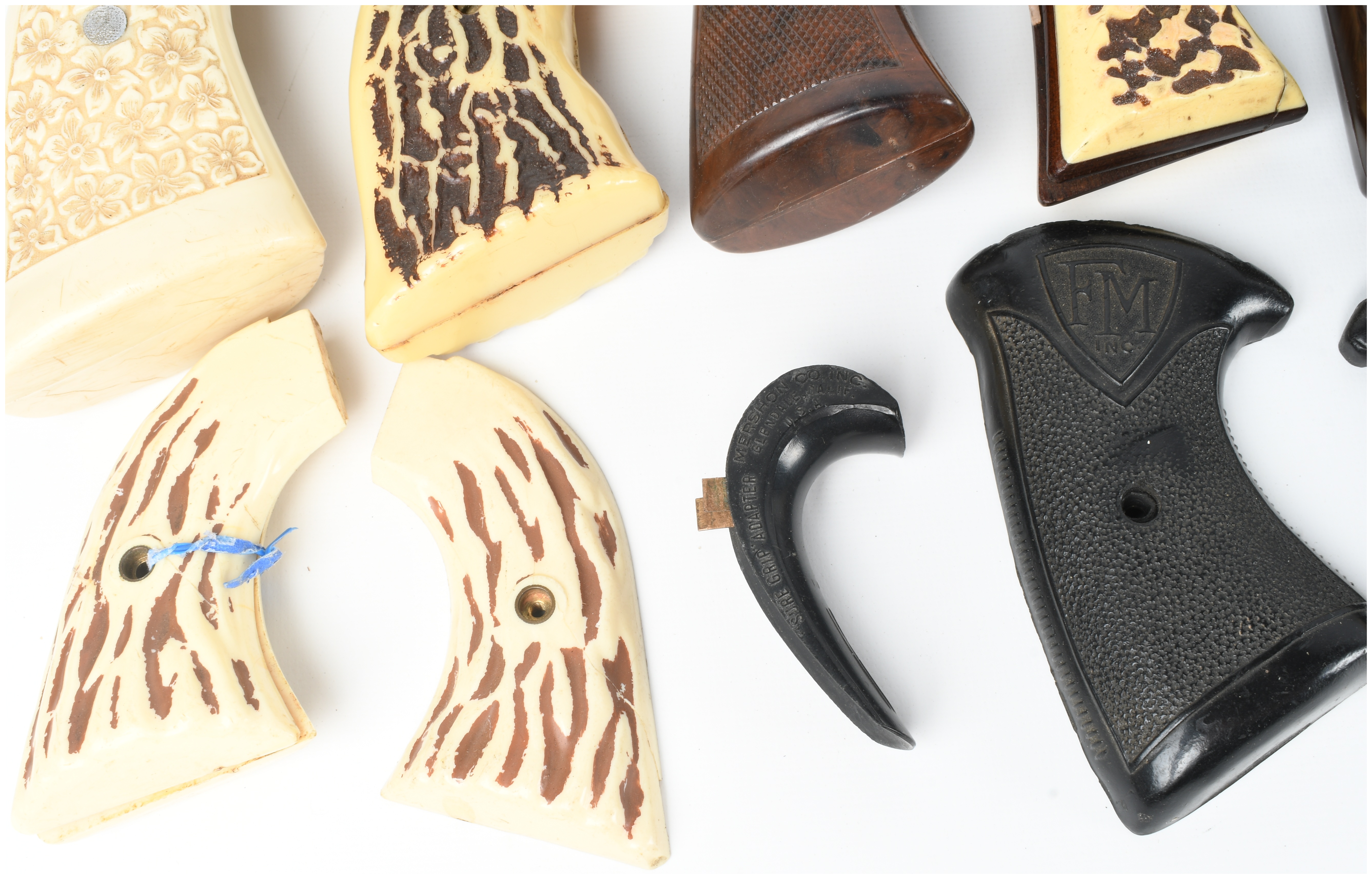 A Collection of 17 Assorted Handgun Grips and Accessories