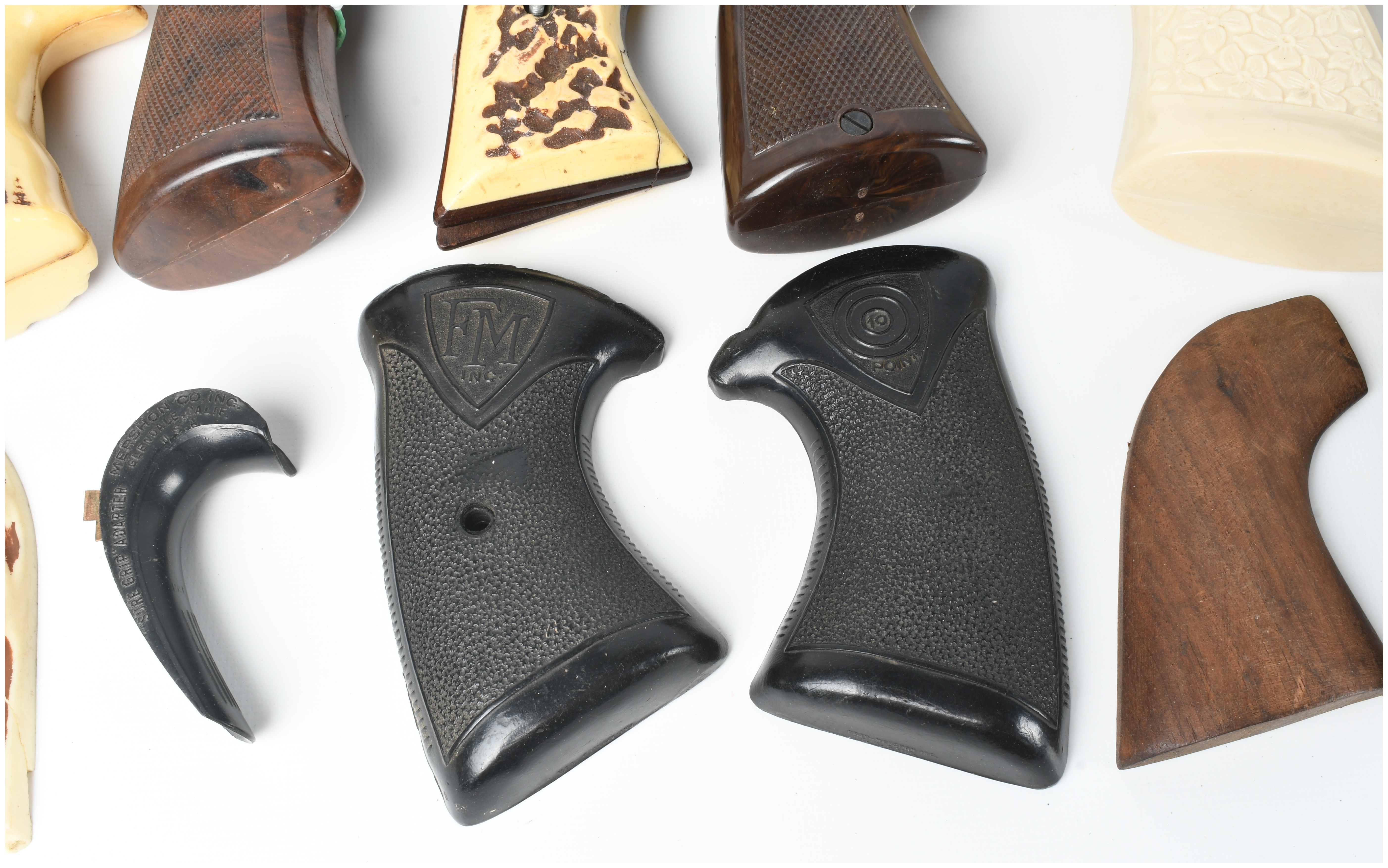 A Collection of 17 Assorted Handgun Grips and Accessories