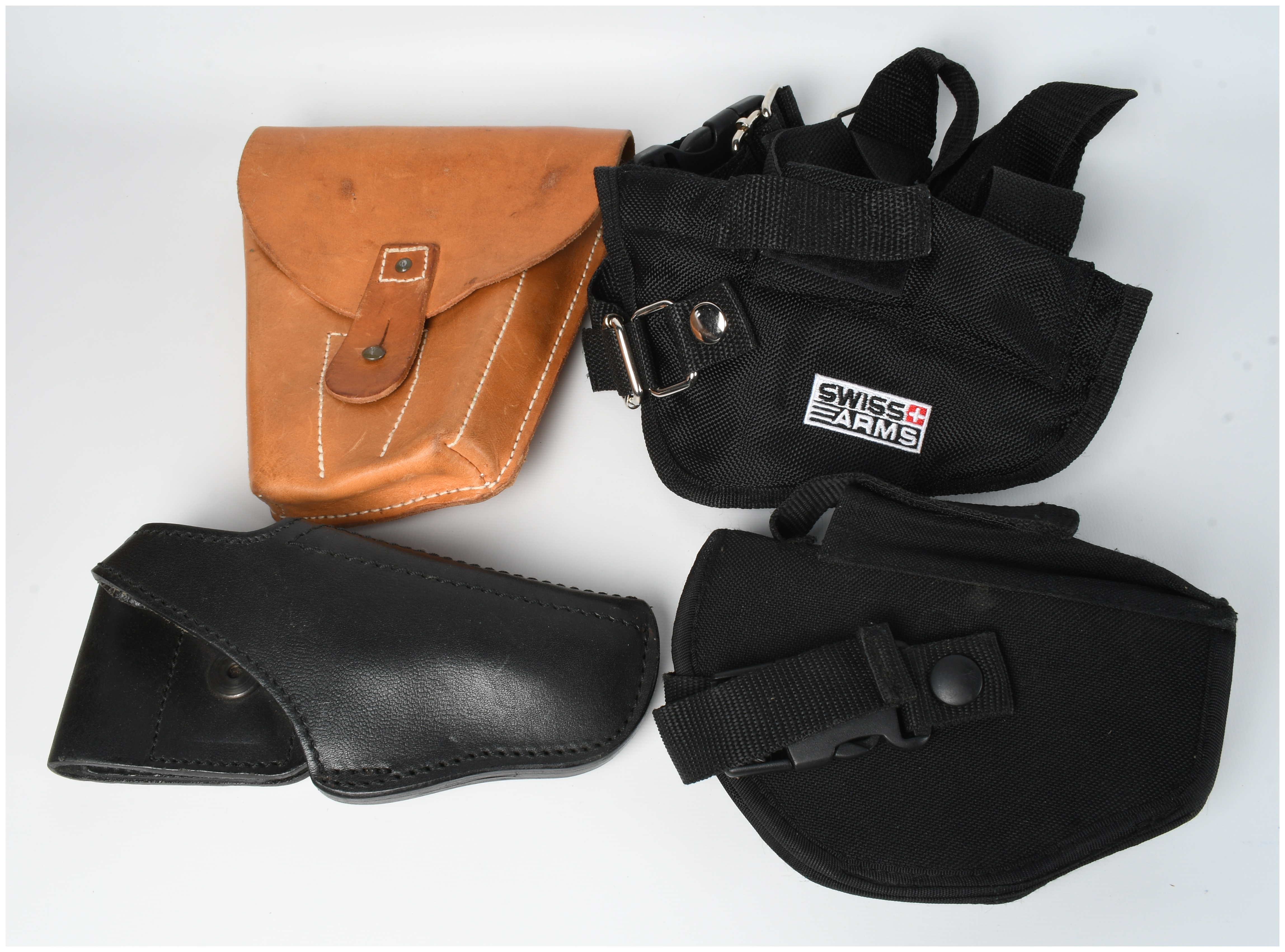 A Collection of 4 Assorted Leather and Nylon Pistol Holsters