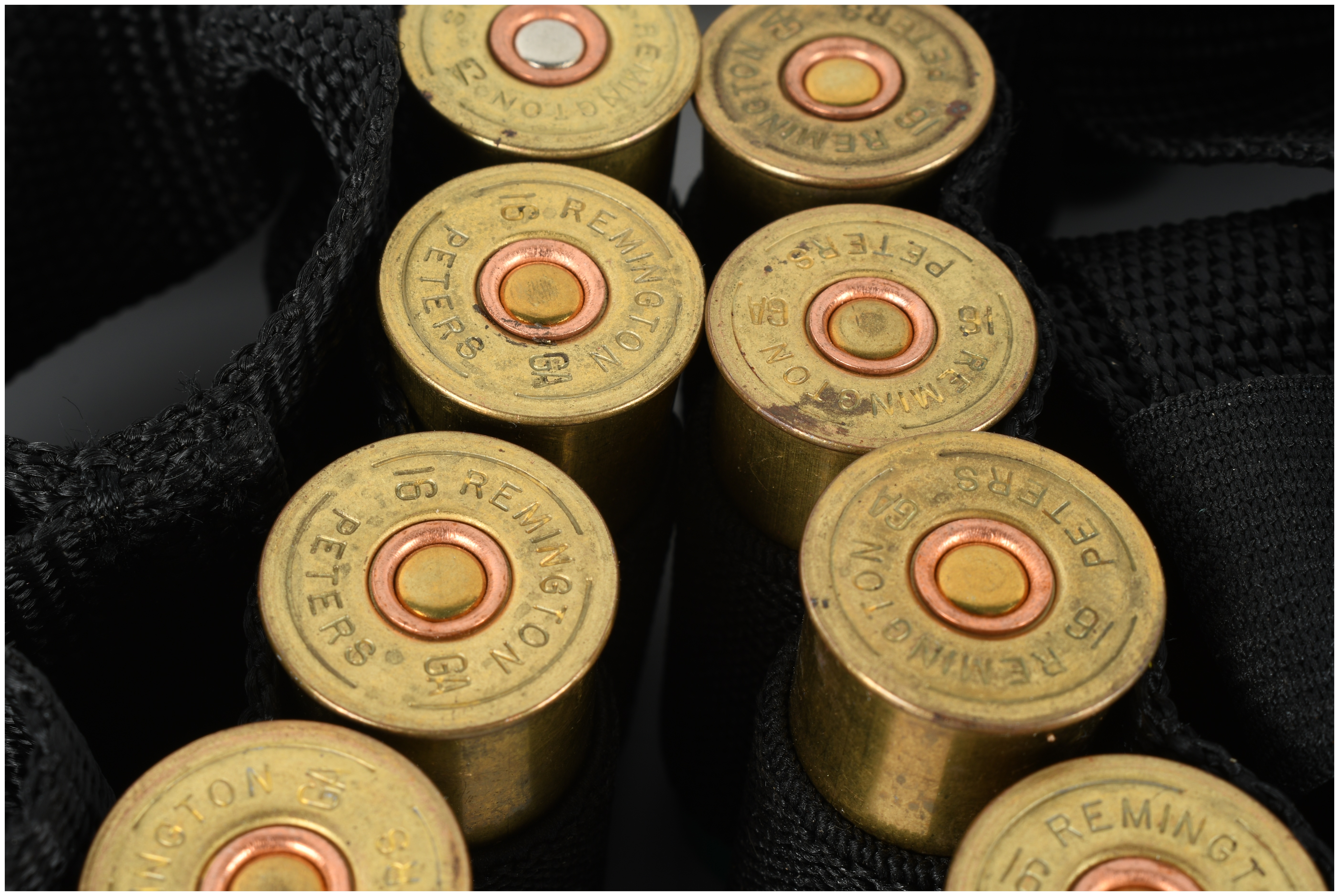 A Group of 50 16 Ga Shotgun Shells and Two Nylon Bandoliers