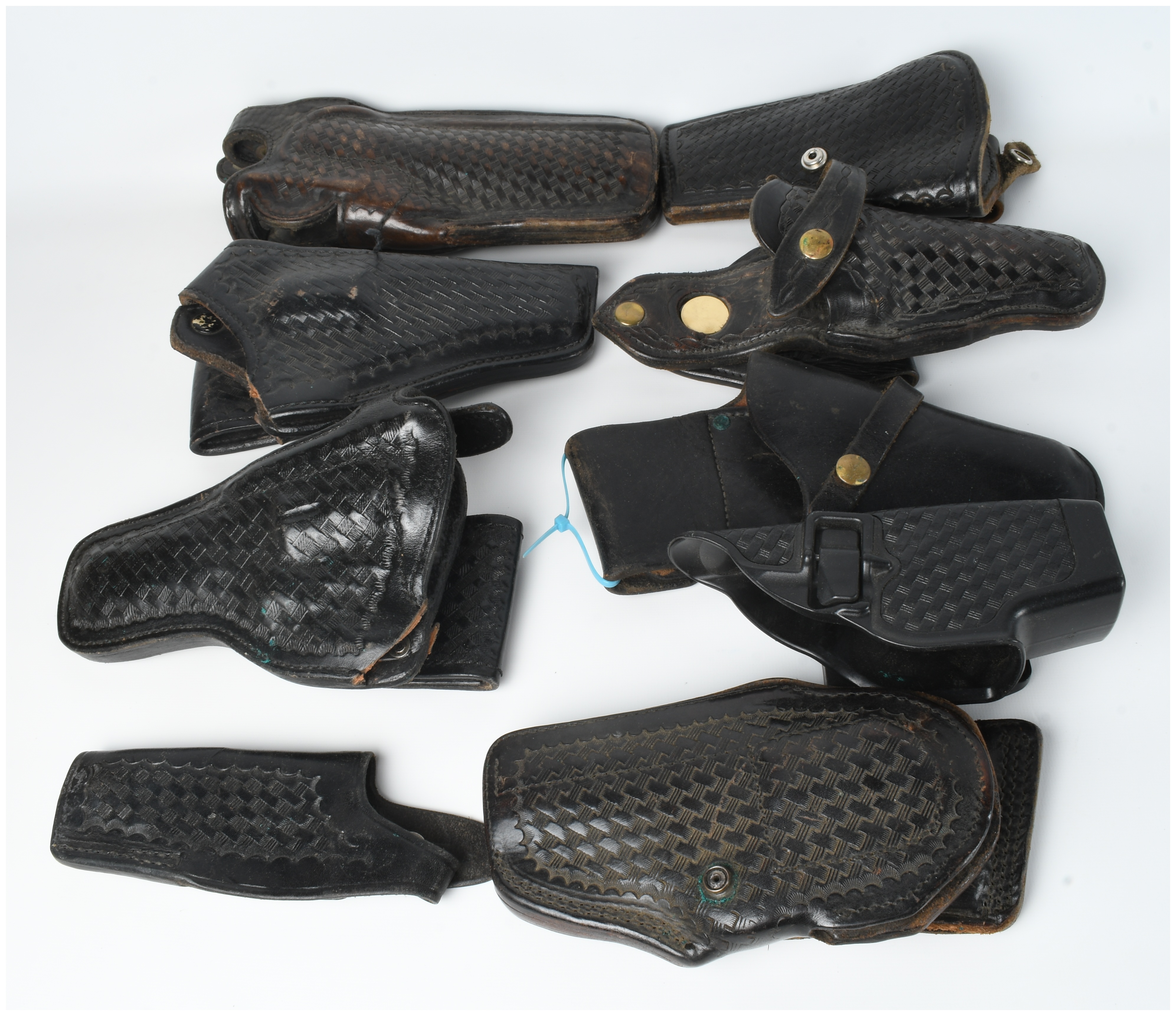 A Collection Of 9 Assorted Leather And Polymer Handgun Holsters