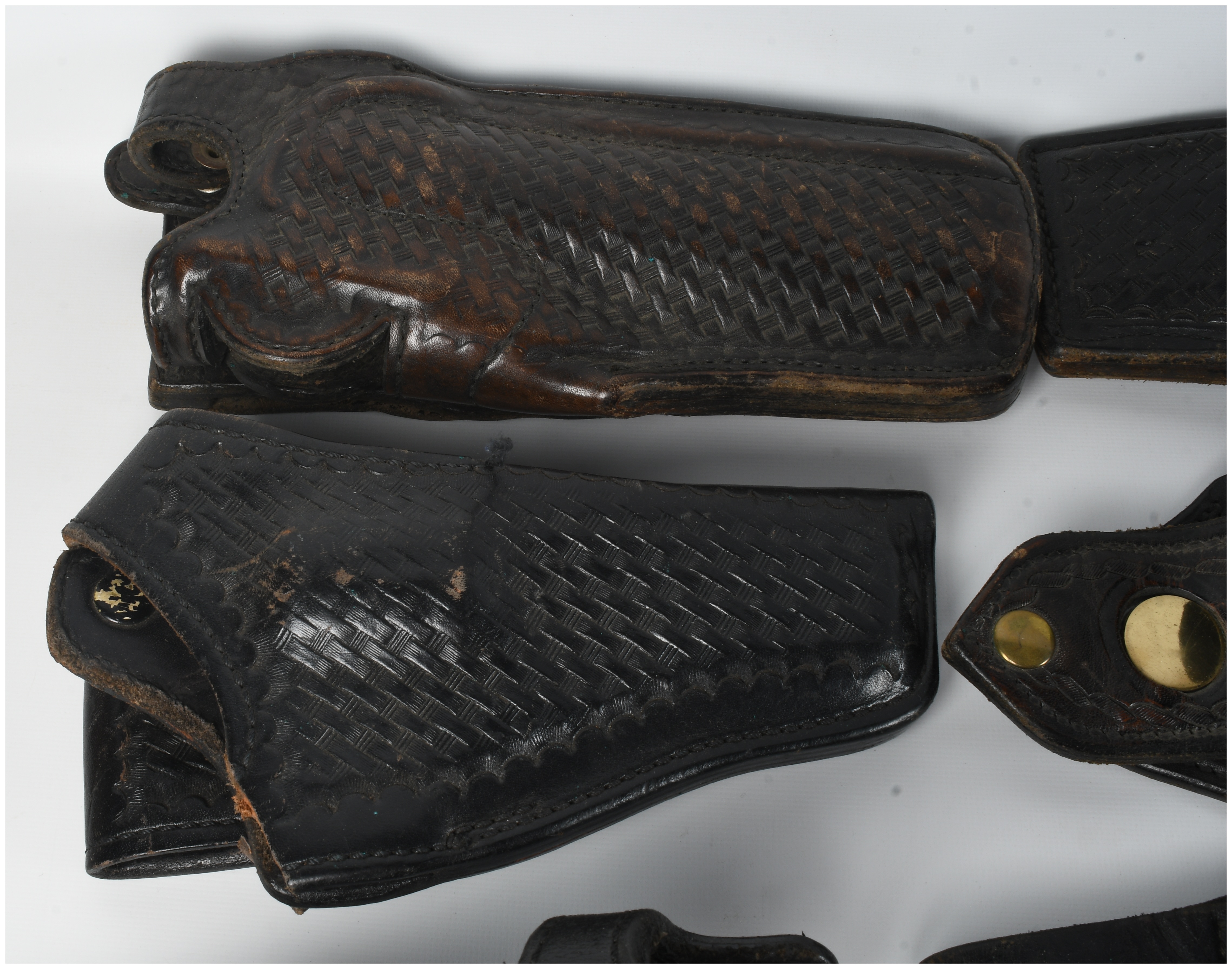 A Collection Of 9 Assorted Leather And Polymer Handgun Holsters