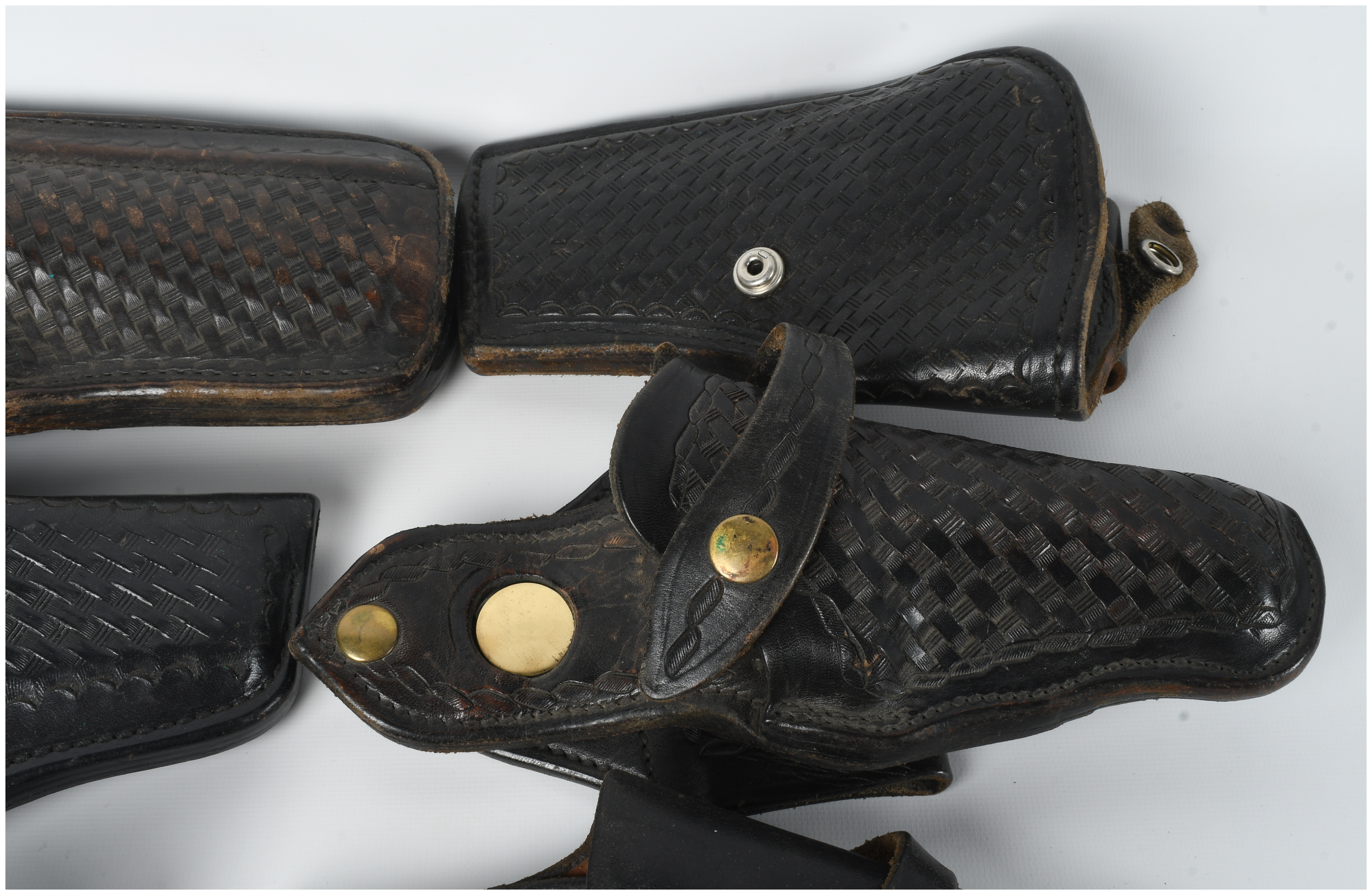 A Collection Of 9 Assorted Leather And Polymer Handgun Holsters