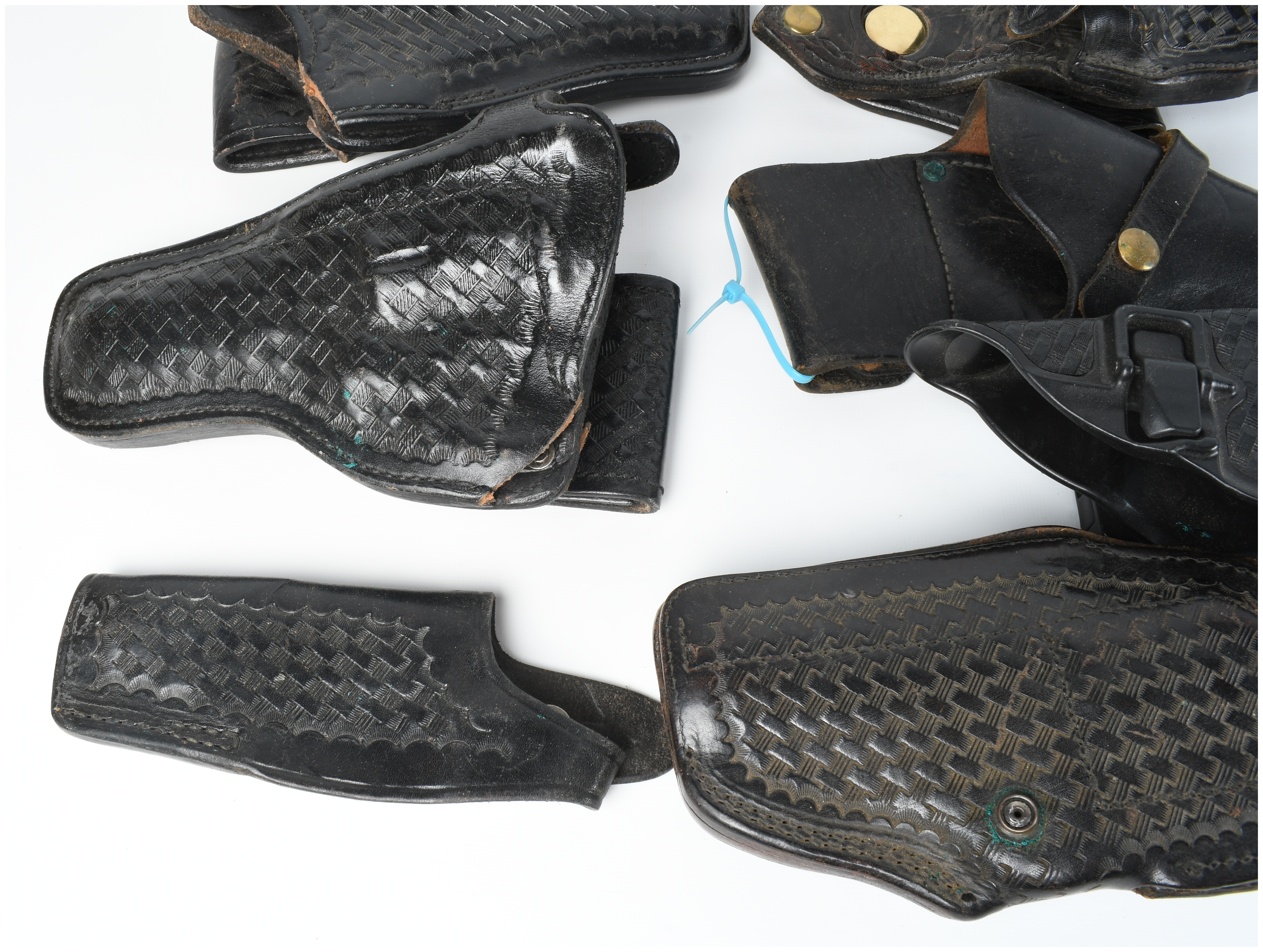 A Collection Of 9 Assorted Leather And Polymer Handgun Holsters