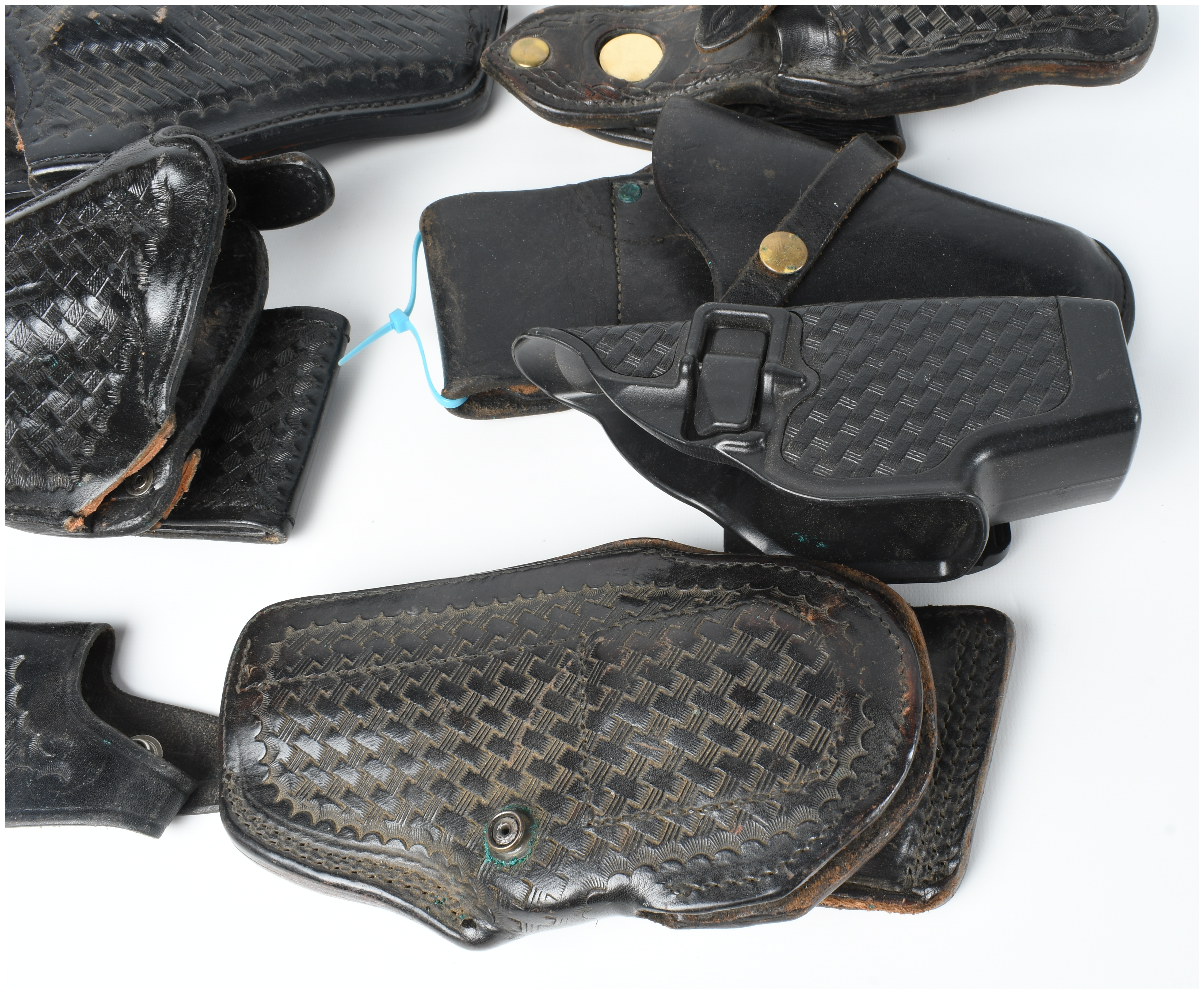 A Collection Of 9 Assorted Leather And Polymer Handgun Holsters