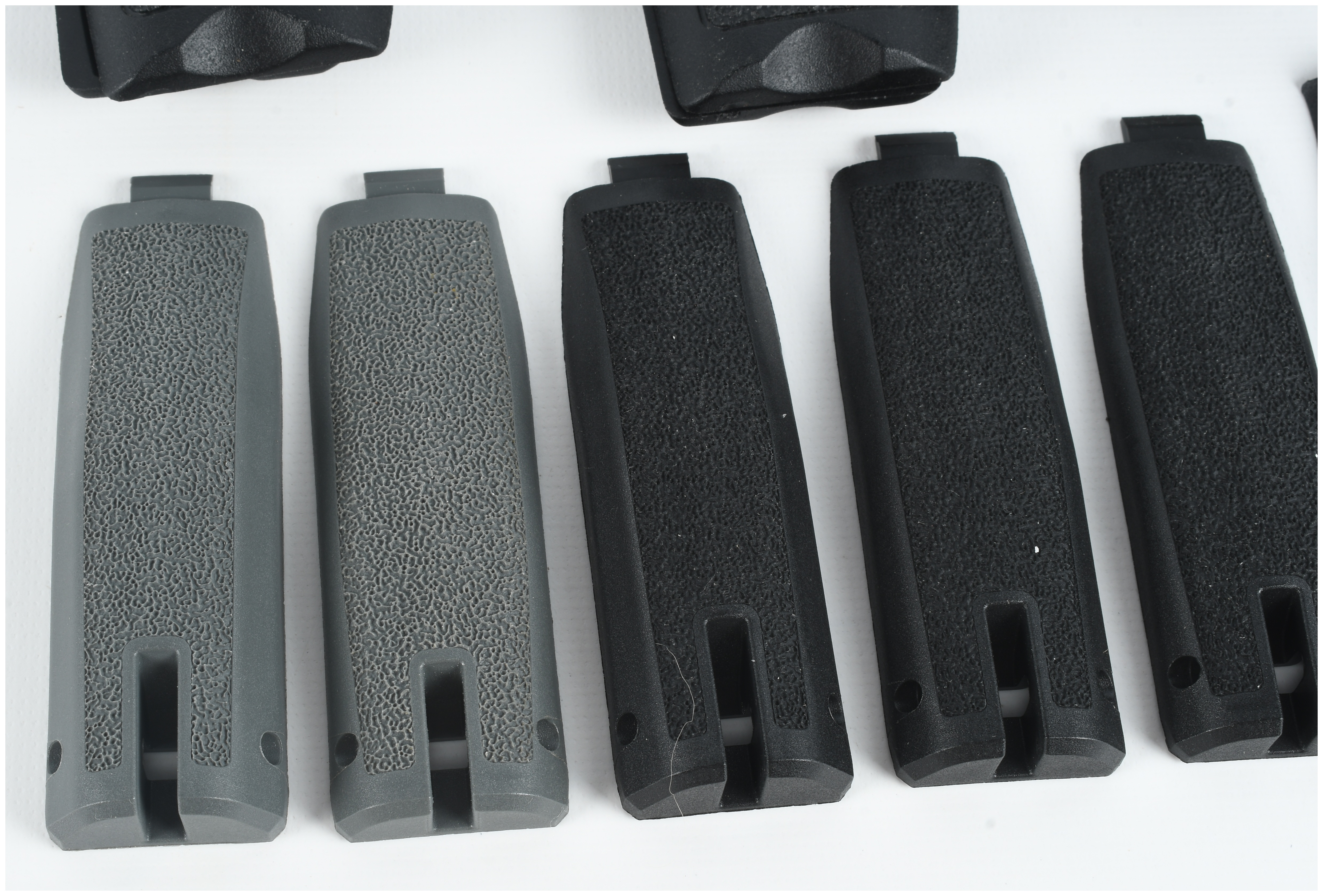 A Collection of 4 Smith & Wesson and FSR Handgun Grips and Backstrap Components