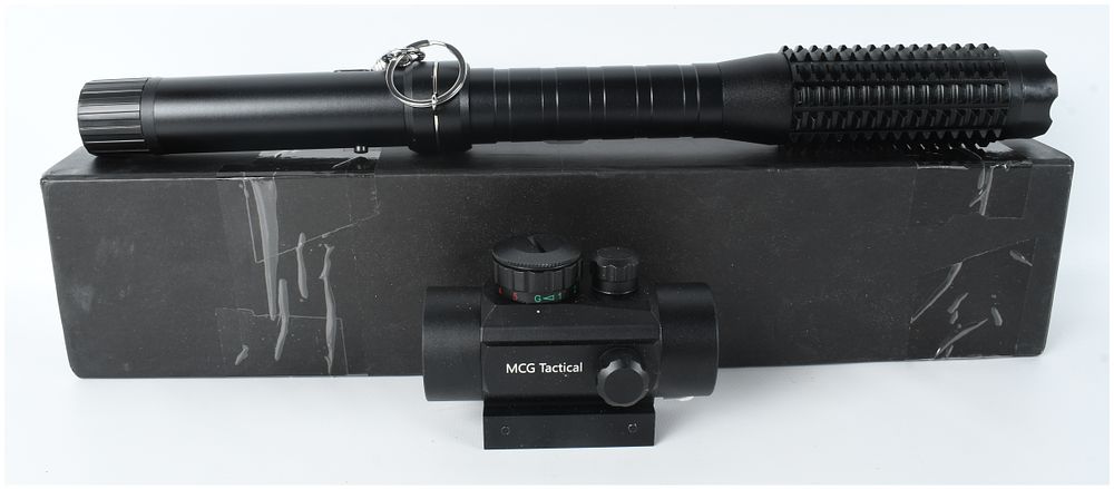 Lot 200: A Group of Two Tactical Accessories Including an MCG Tactical Red Dot Sight and a Stun Baton Flashlight