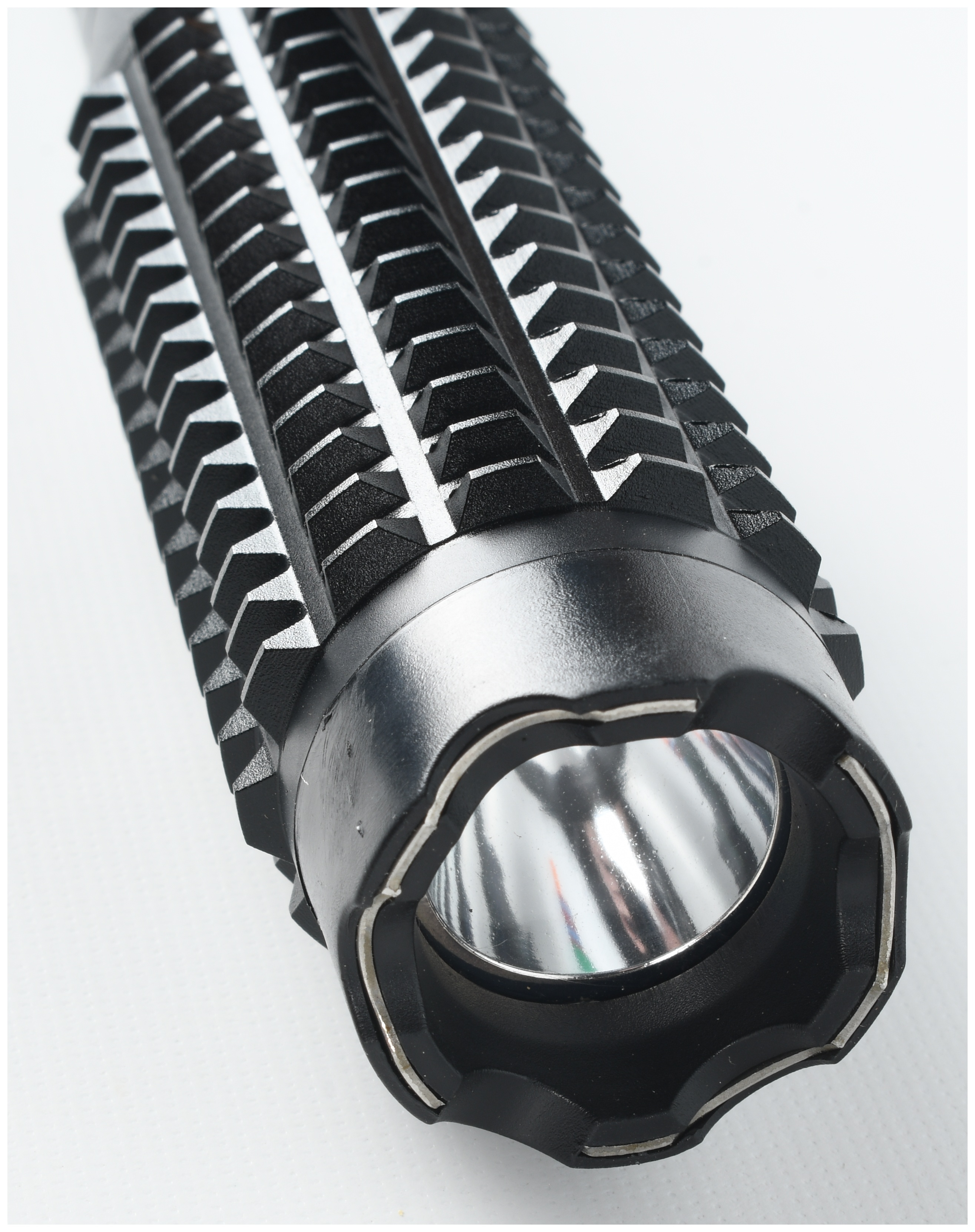 A Group of Two Tactical Accessories Including an MCG Tactical Red Dot Sight and a Stun Baton Flashlight