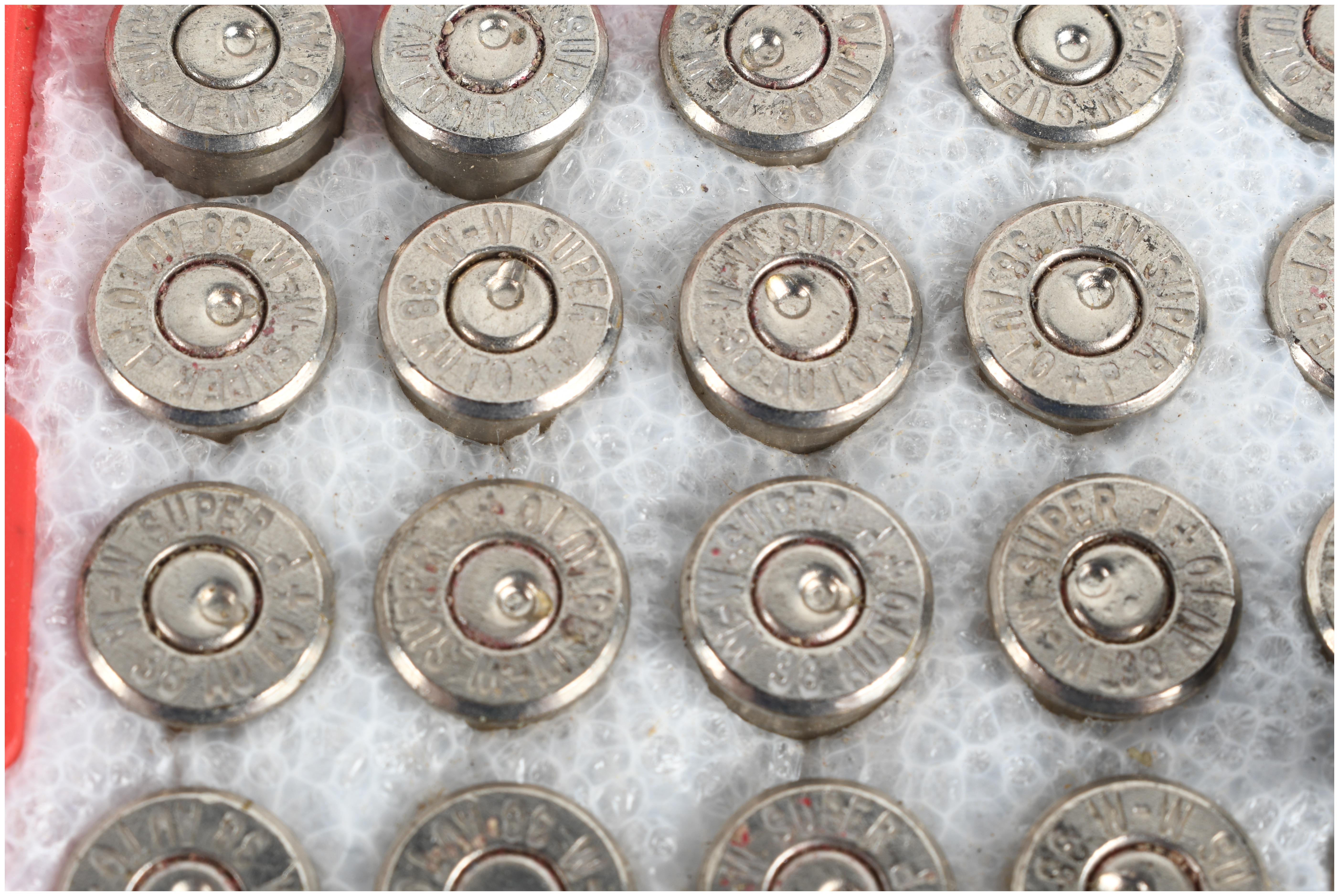 A Collection of 100 Winchester Super-X 38 Automatic Spent Ammunition Casings and Boxes