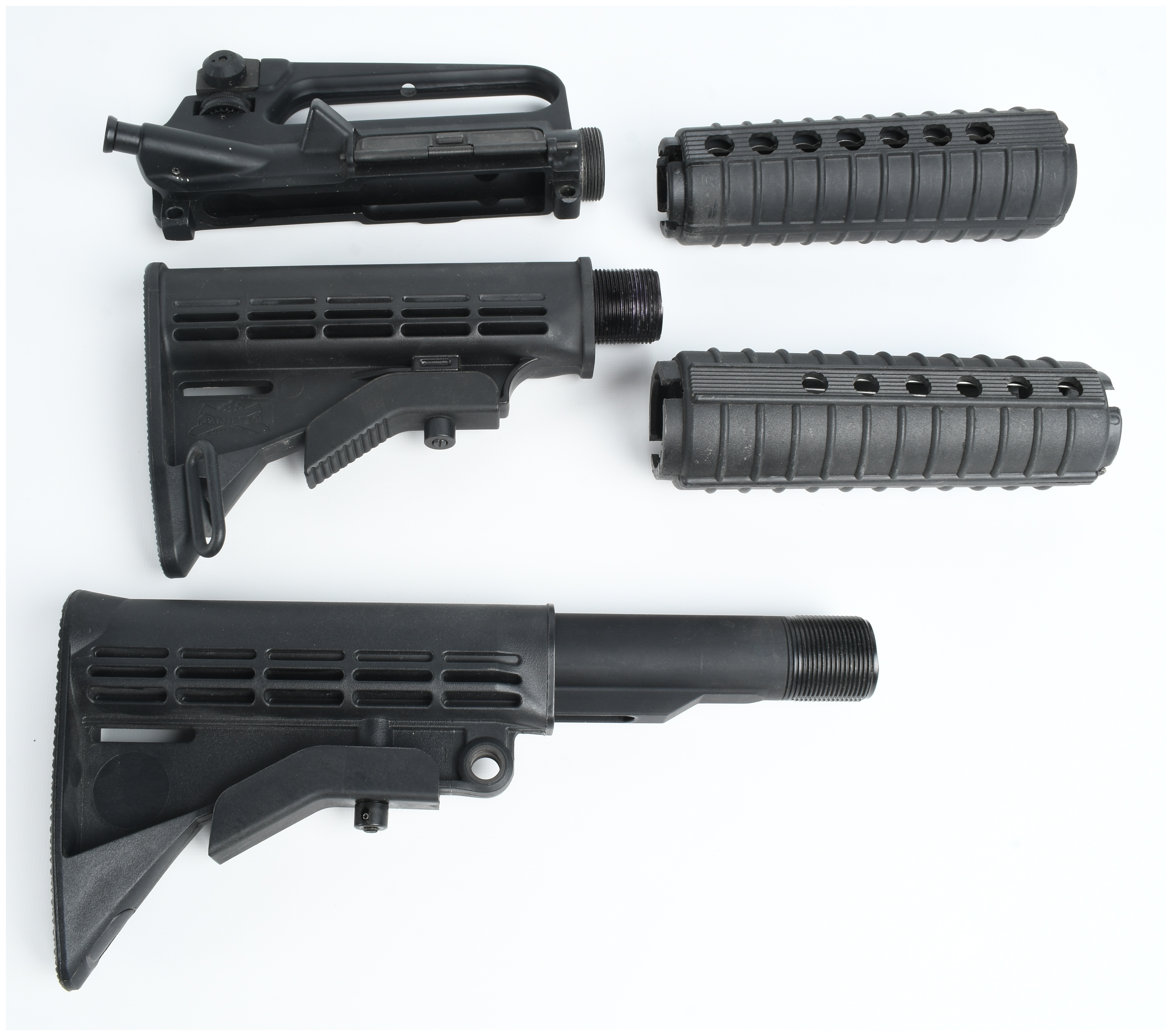 A Collection of 5 AR-15 Components Including a Stripped Upper Receiver and Collapsible Stocks