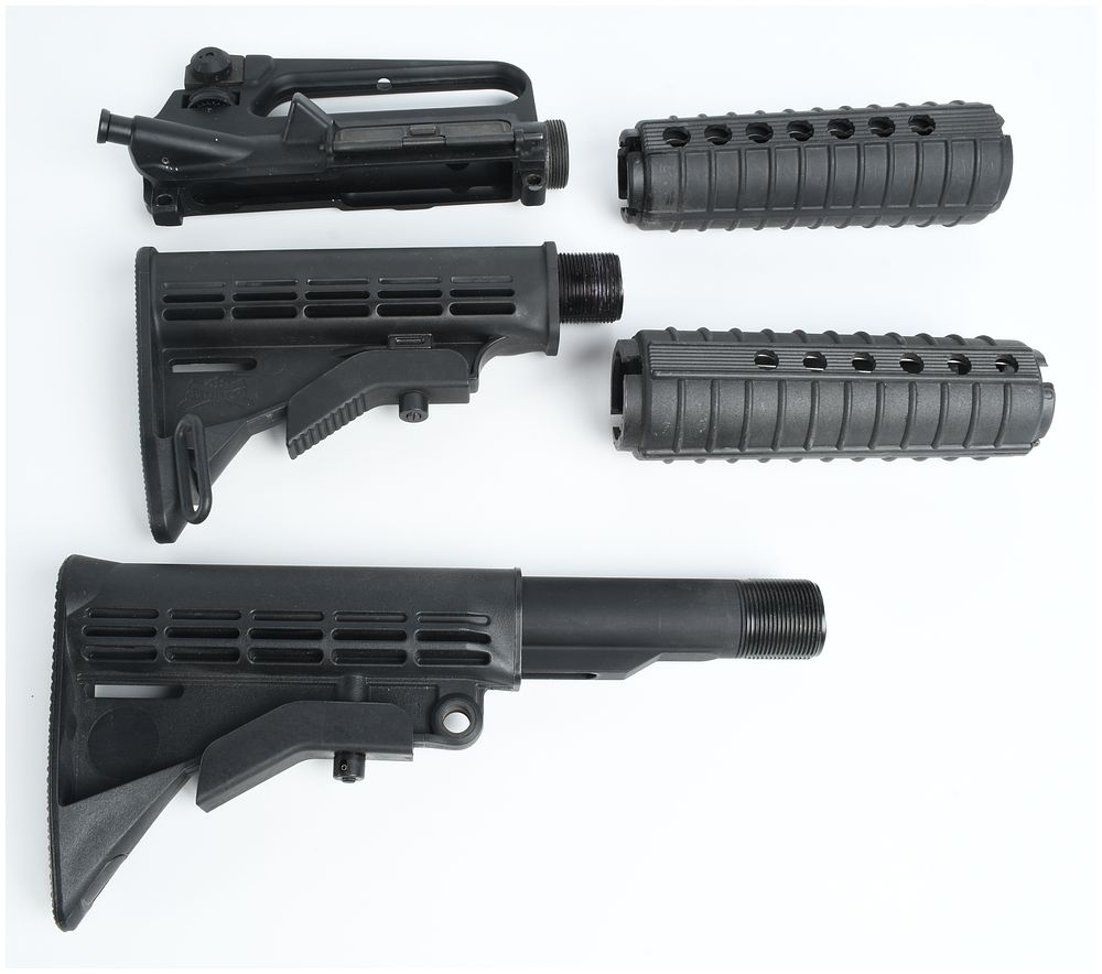 Lot 242: A Collection of 5 AR-15 Components Including a Stripped Upper Receiver and Collapsible Stocks