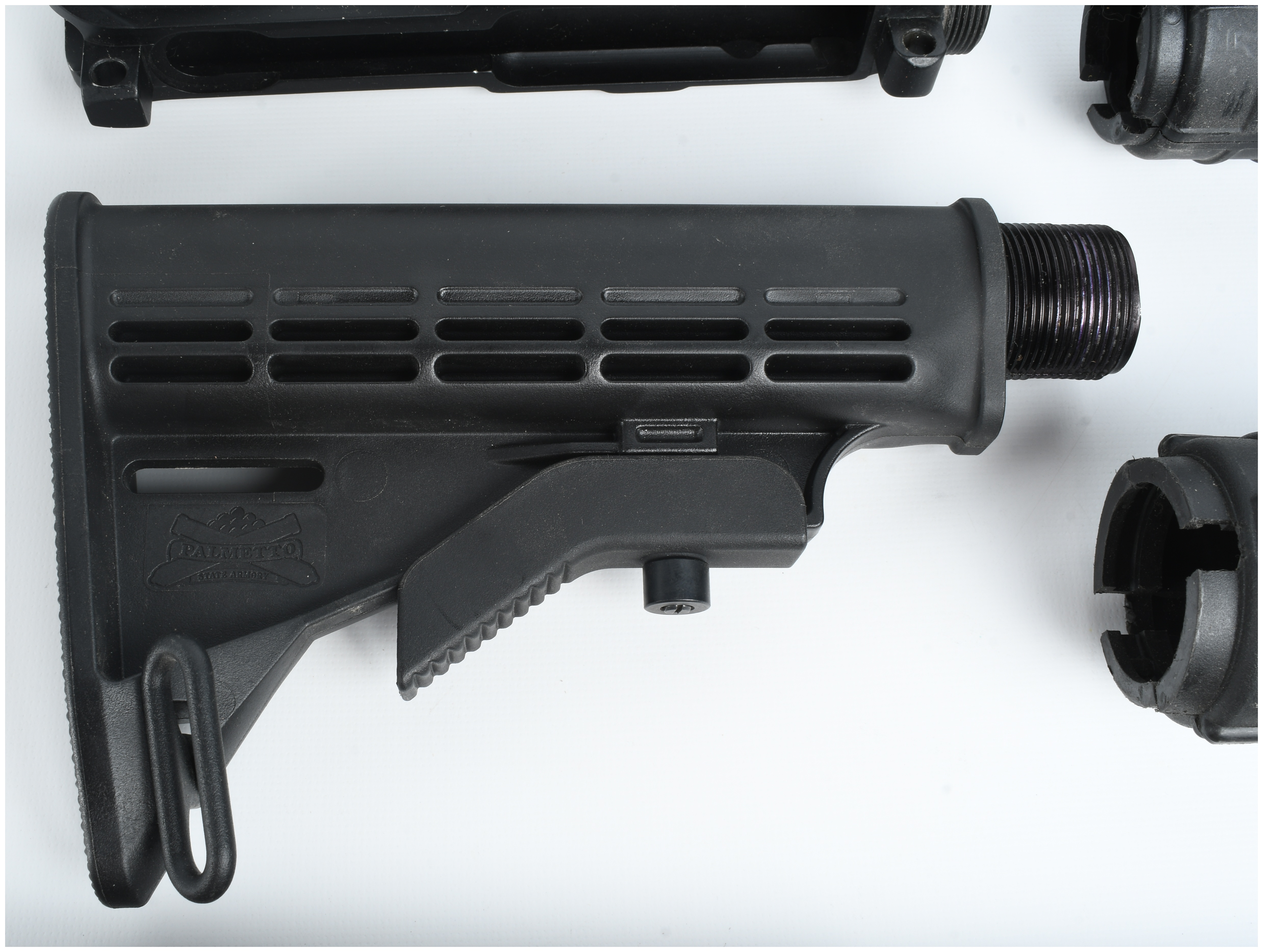 A Collection of 5 AR-15 Components Including a Stripped Upper Receiver and Collapsible Stocks