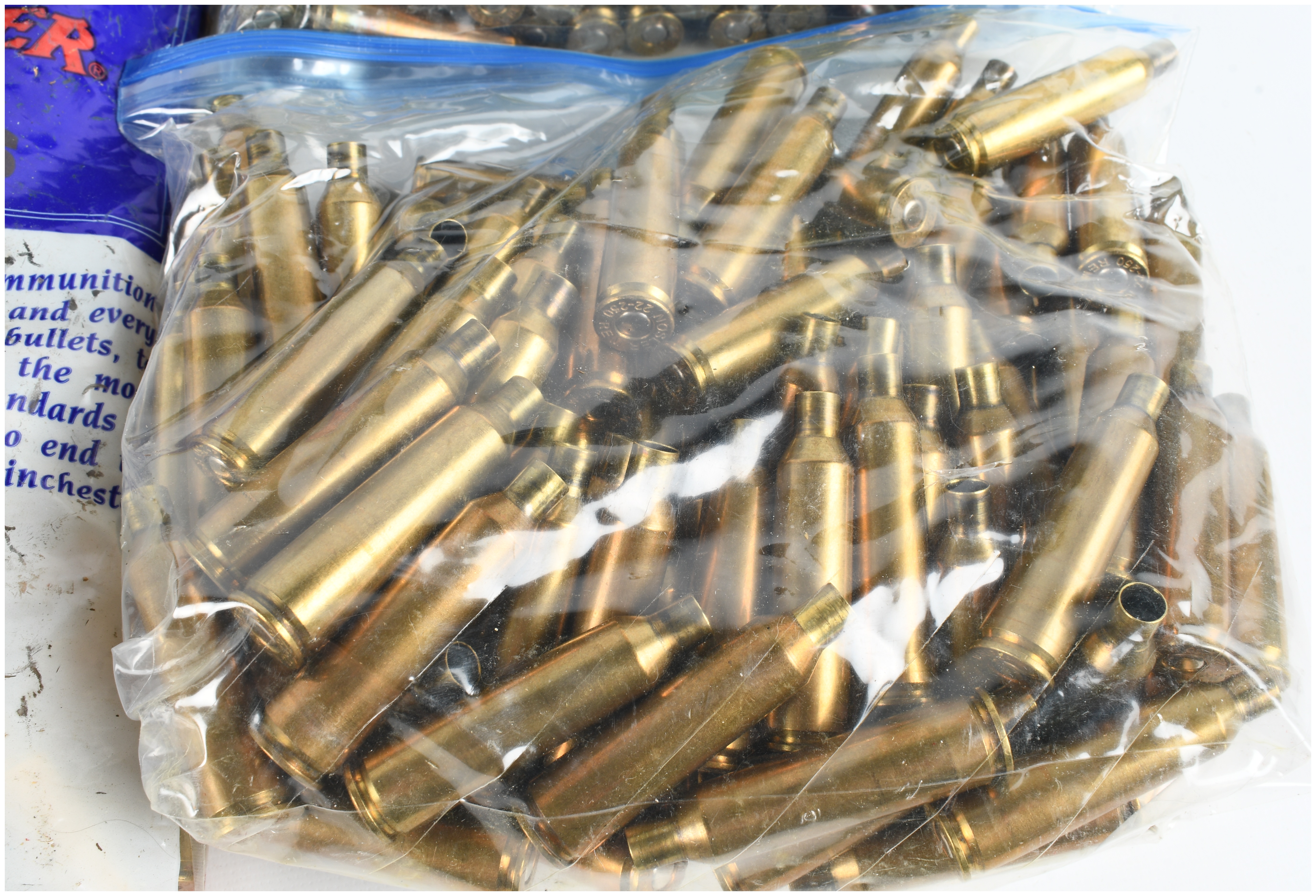 A Lot of 400 .22-250 Remington Caliber Brass Cartridge Cases and One Ammunition Can