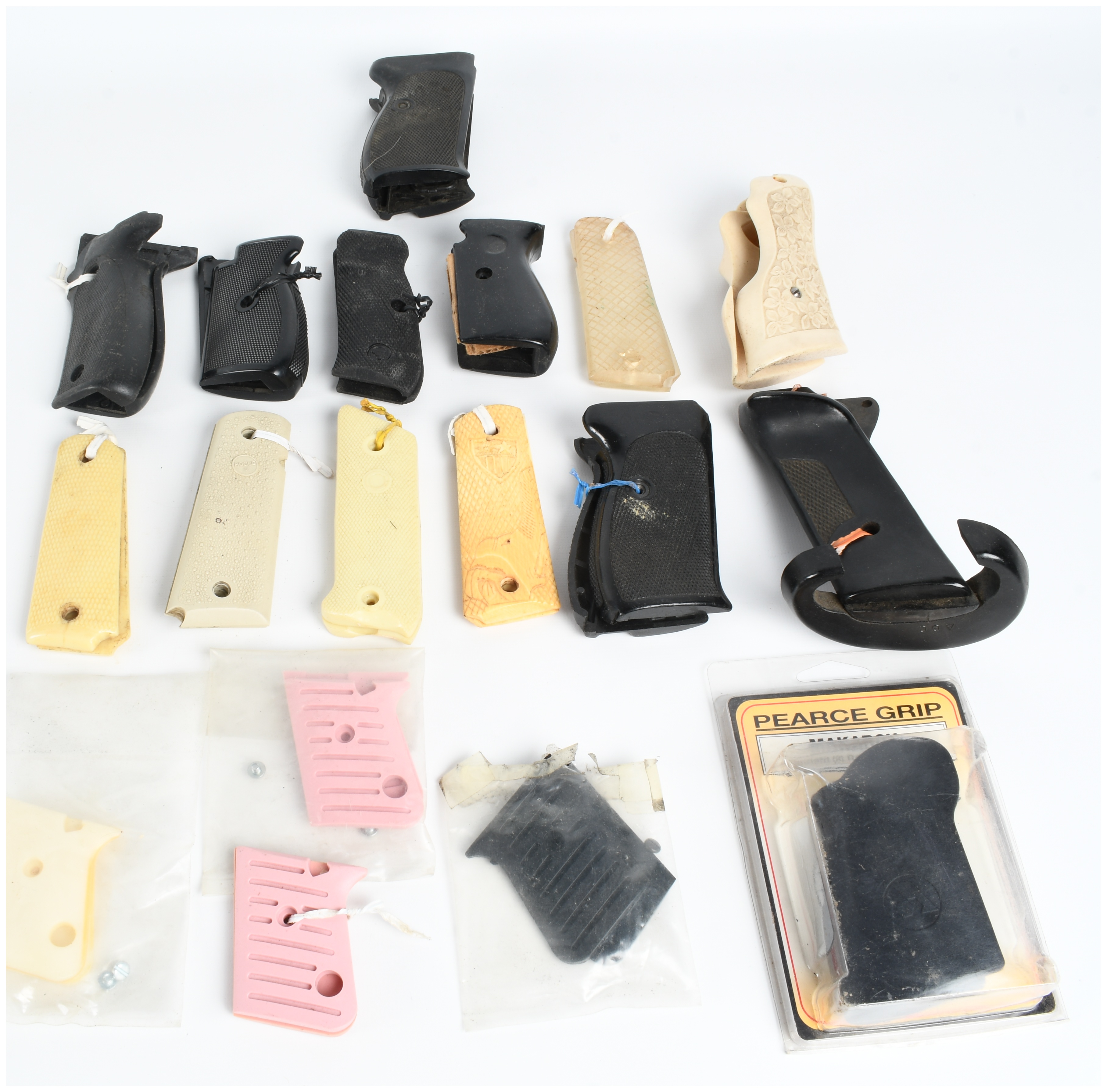 A Collection of 18 Assorted Handgun Grips and Accessories including Pearce Grip and Hogue Examples