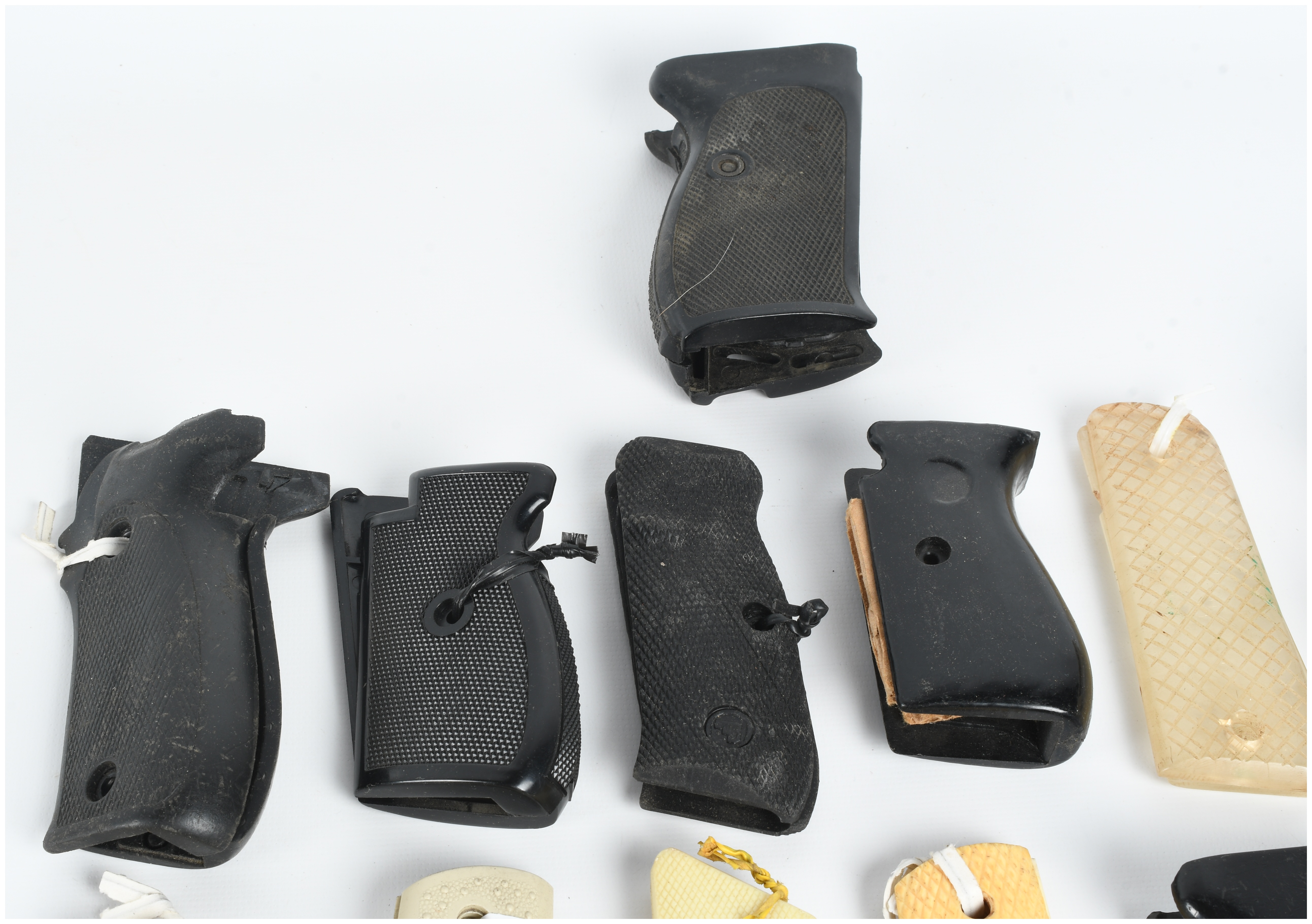 A Collection of 18 Assorted Handgun Grips and Accessories including Pearce Grip and Hogue Examples