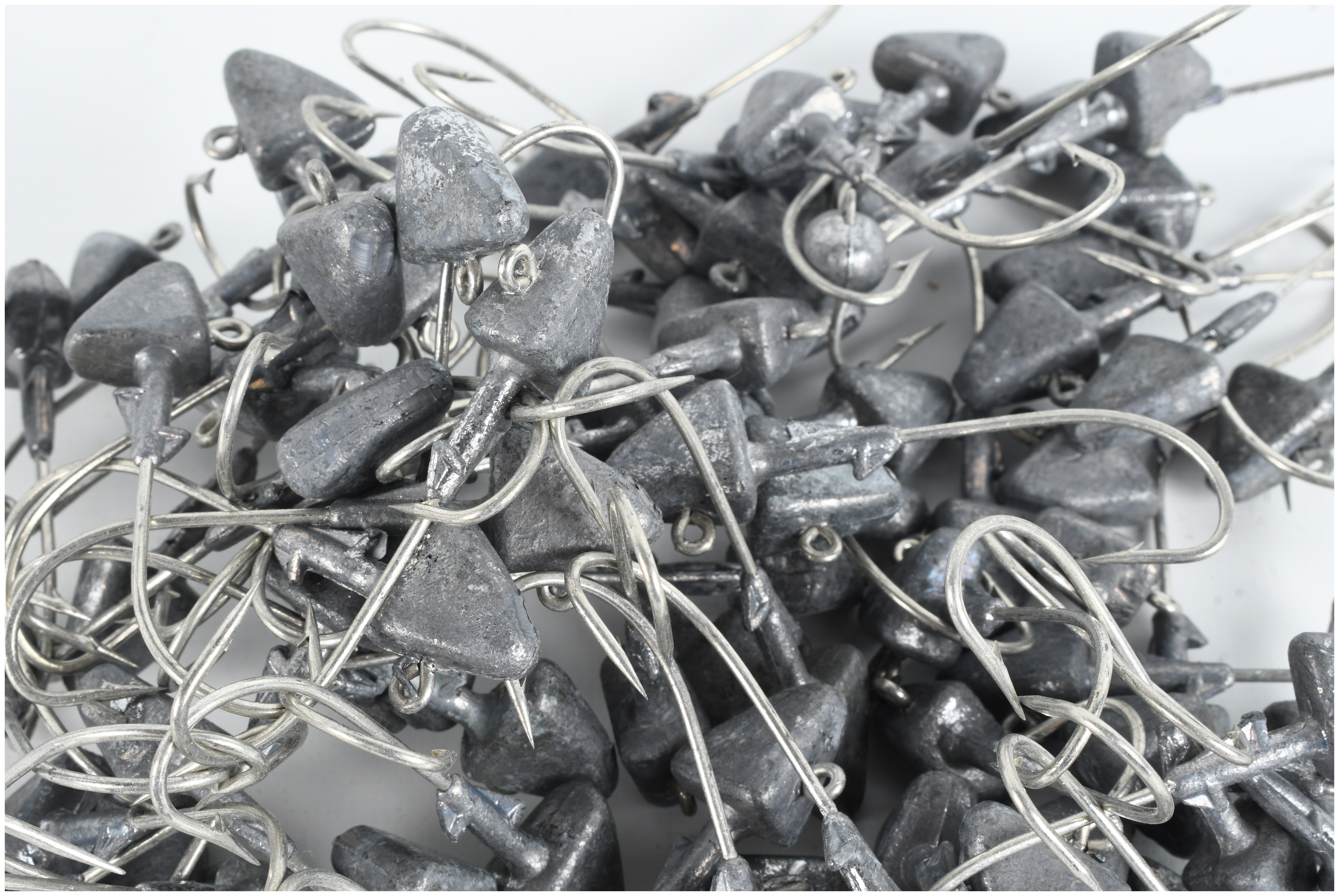 A Collection of 105 Triangular Lead Fishing Jig Heads