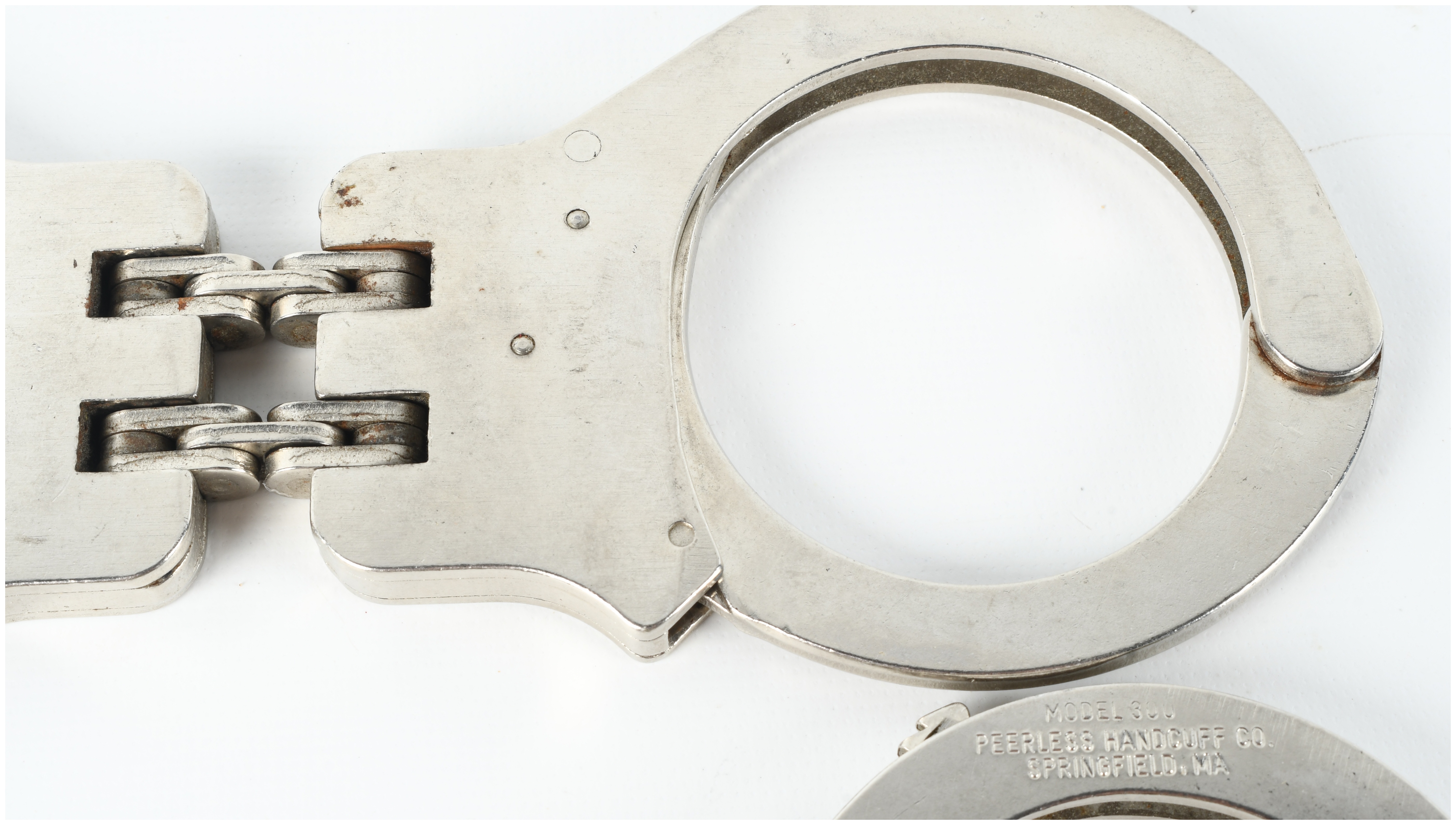 Two Pairs of Peerless Handcuffs Including Model 300 and Hinged Model