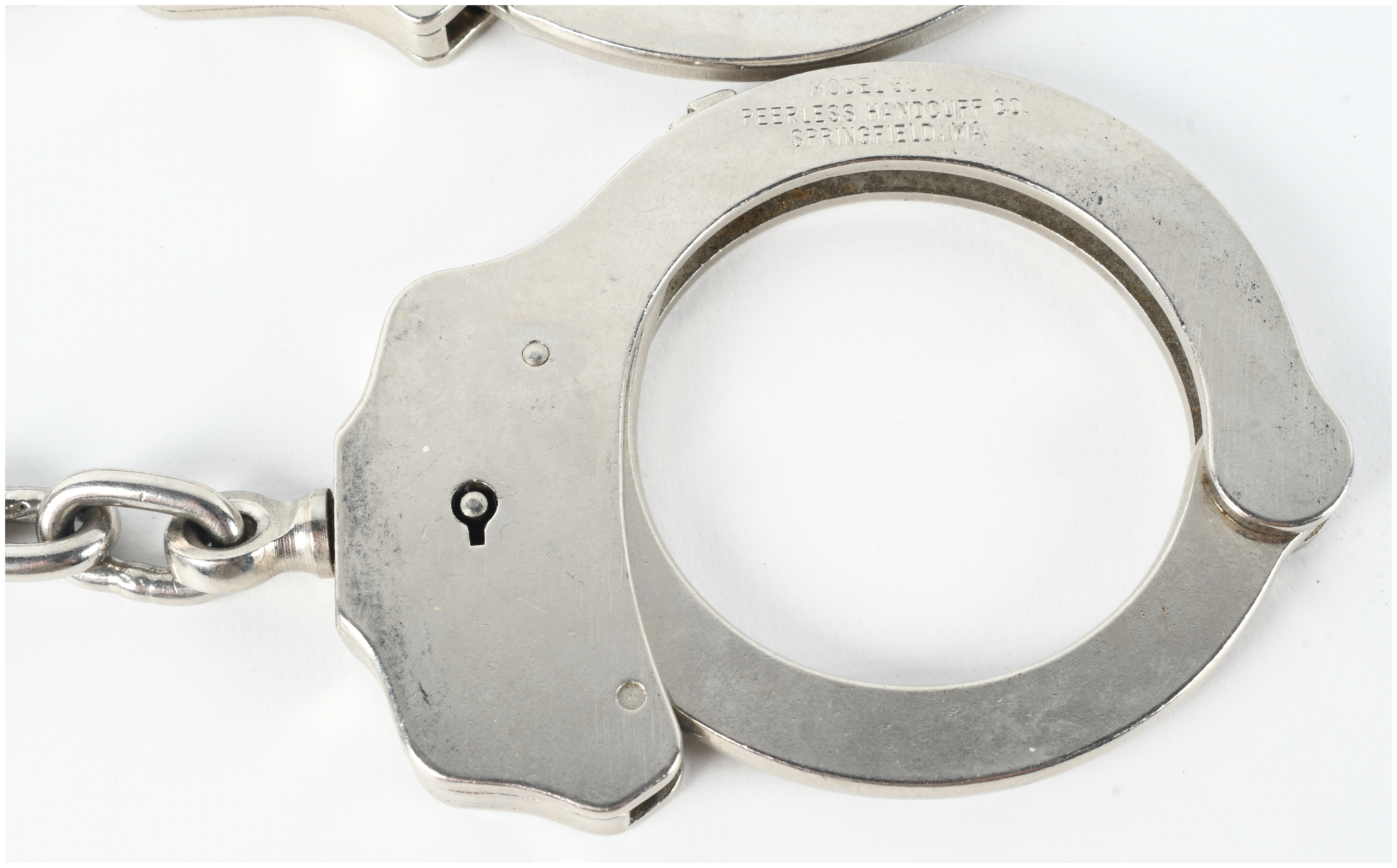 Two Pairs of Peerless Handcuffs Including Model 300 and Hinged Model