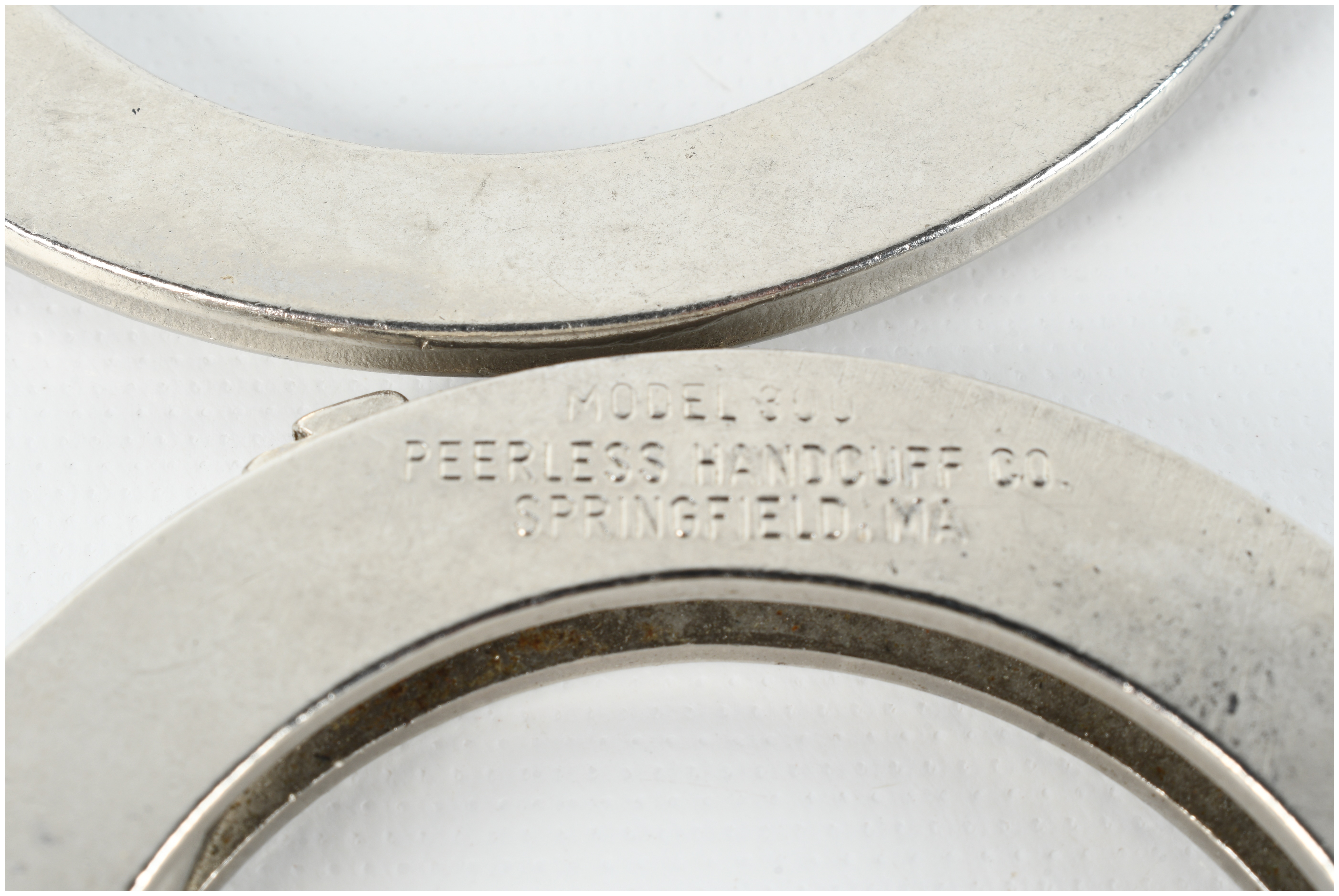 Two Pairs of Peerless Handcuffs Including Model 300 and Hinged Model