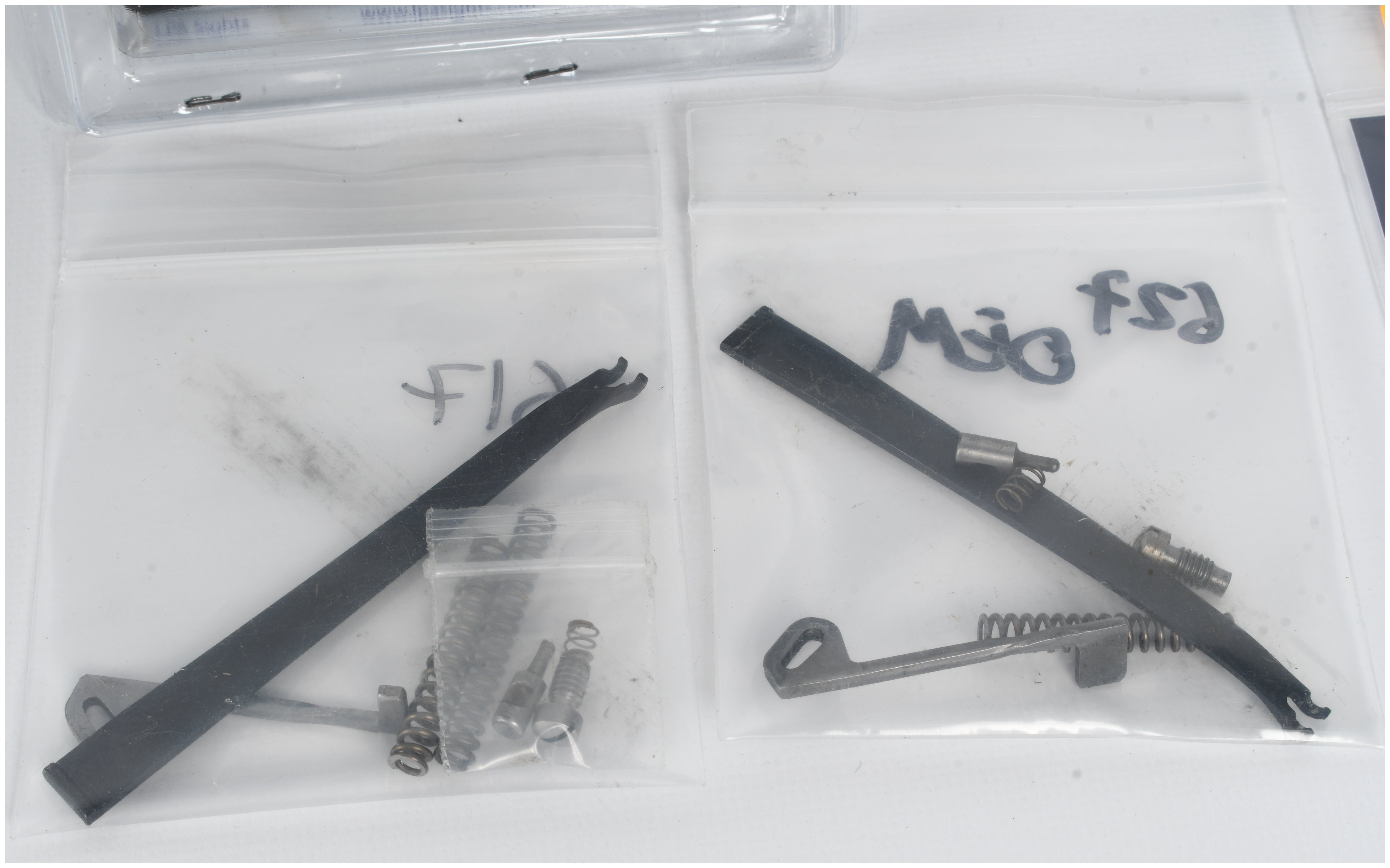 A Collection of 6 Smith & Wesson Revolver Parts and Accessories