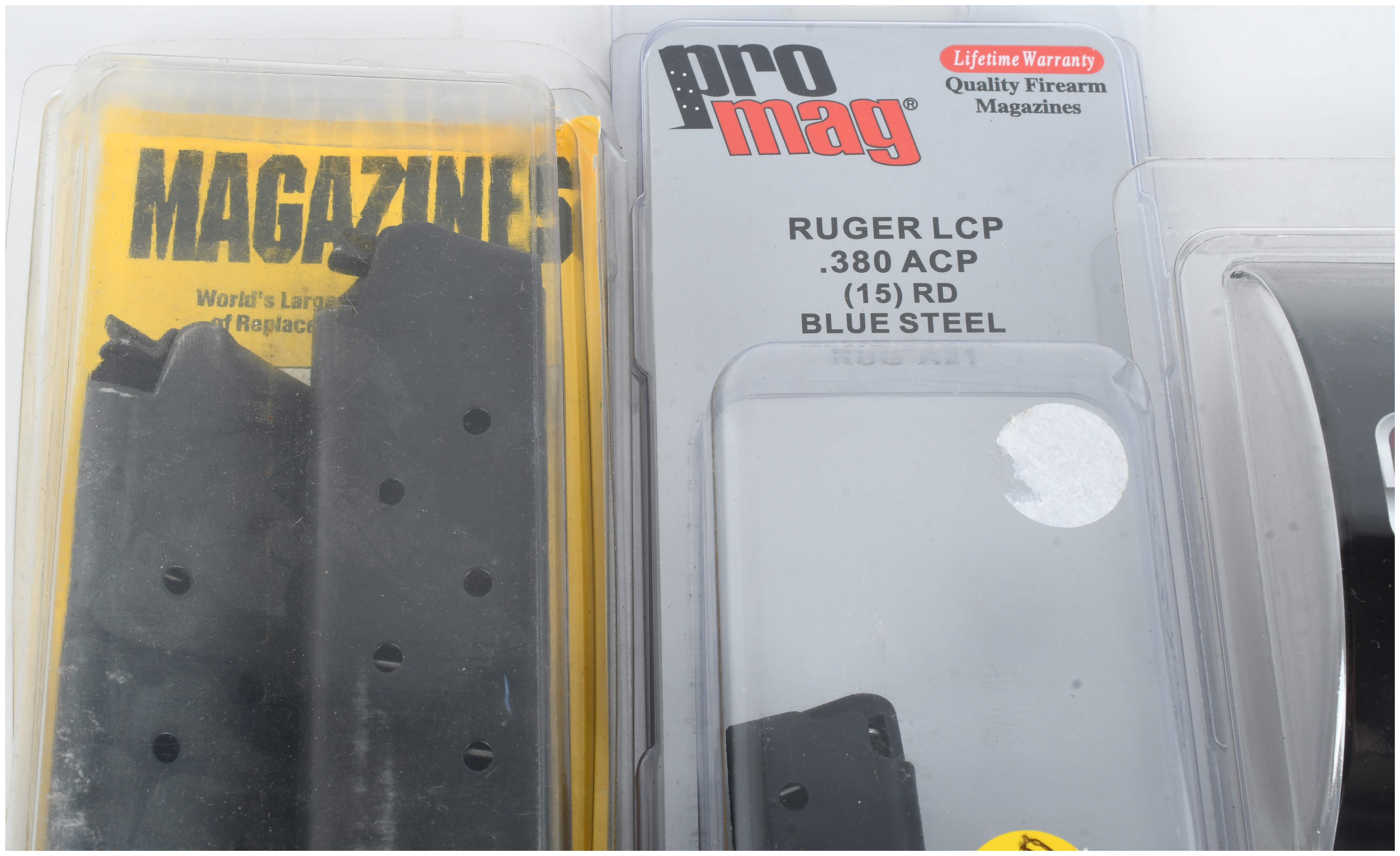 A Trio of Firearm Accessories Including 15-Round Magazines for Colt 1911 and Ruger LCP and a Galco Holster Care Kit