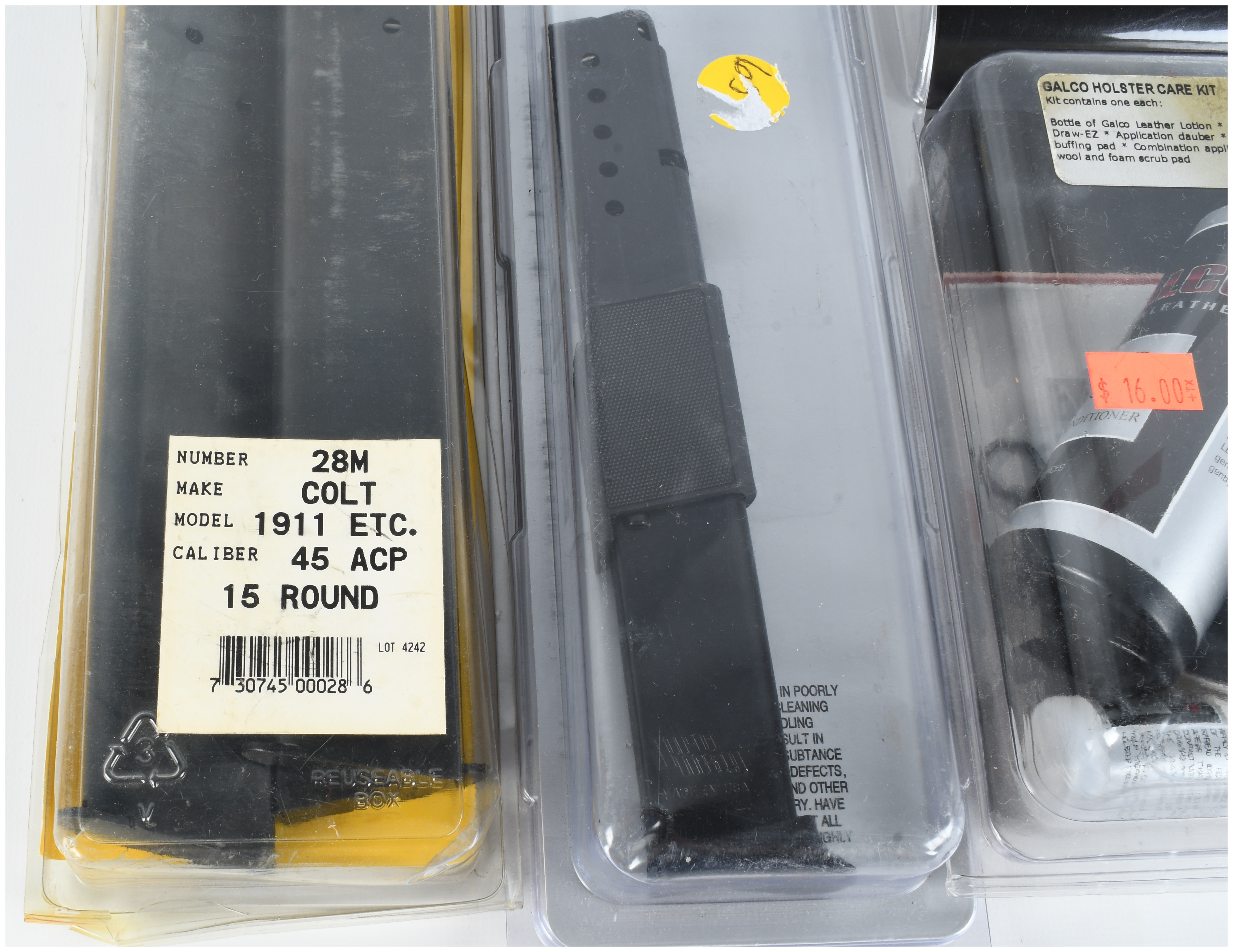 A Trio of Firearm Accessories Including 15-Round Magazines for Colt 1911 and Ruger LCP and a Galco Holster Care Kit