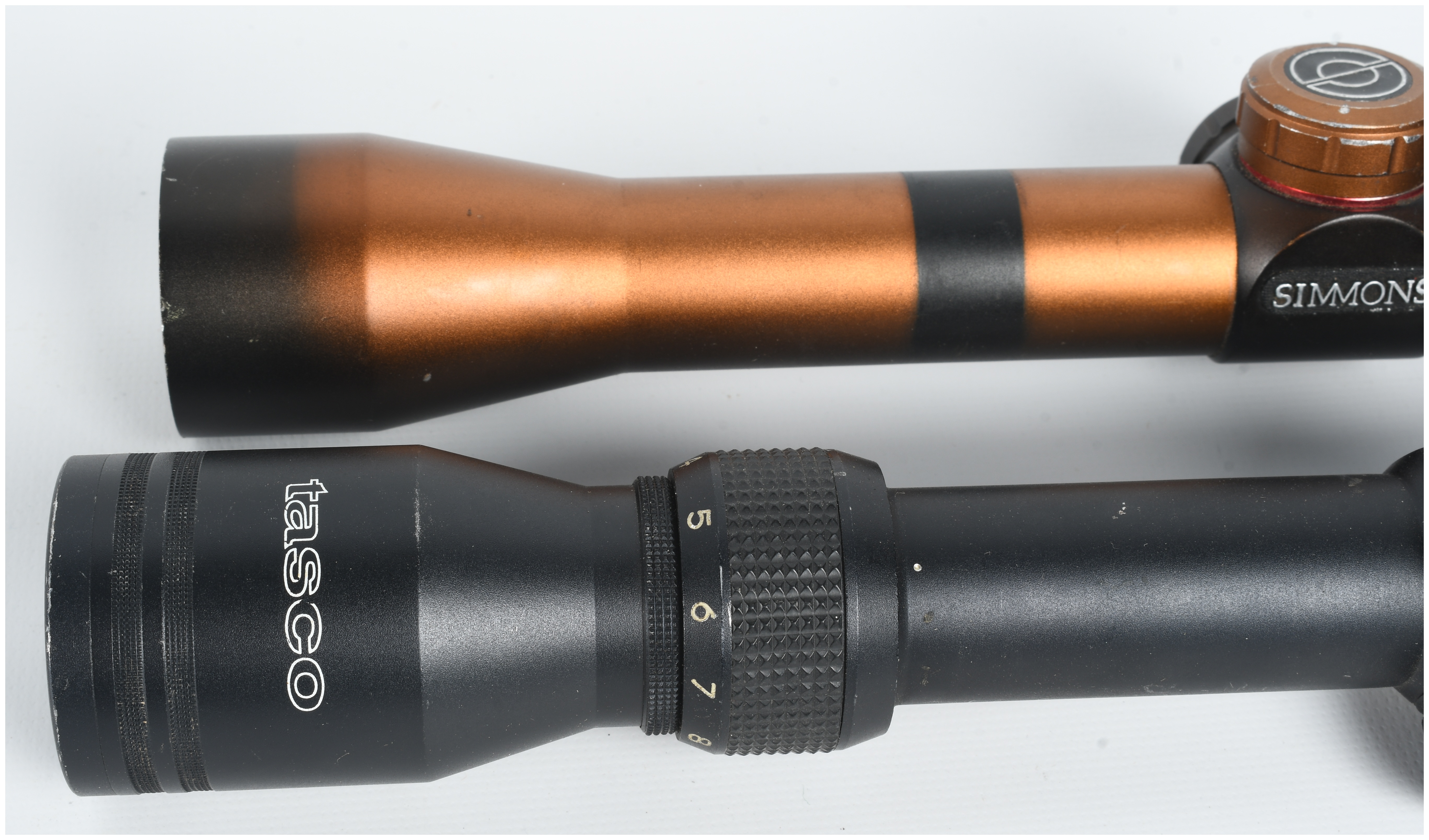 A Pair of Variable-Power Rifle Scopes Including Simmons 3-9x32 22 Mag and Tasco