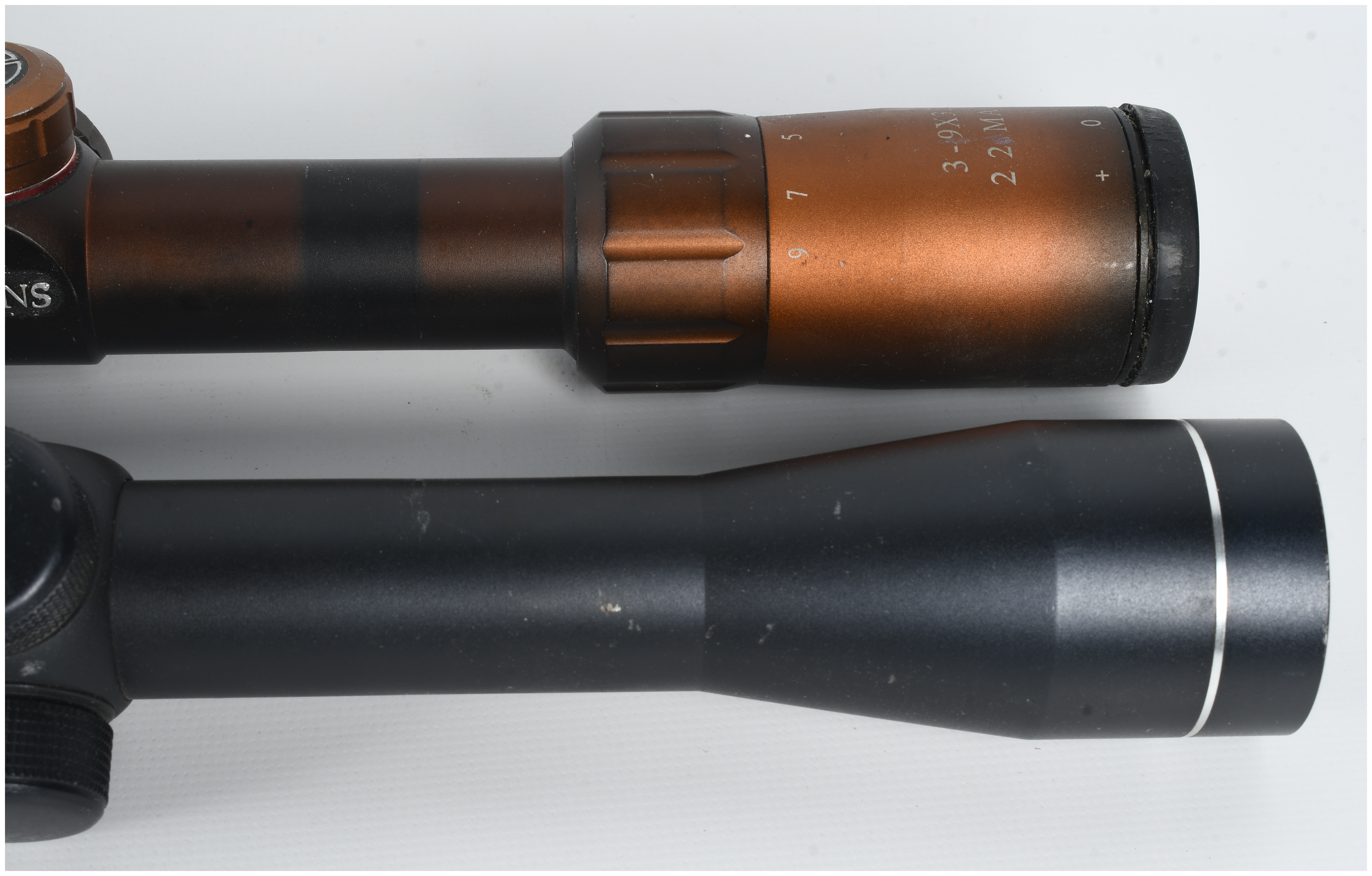 A Pair of Variable-Power Rifle Scopes Including Simmons 3-9x32 22 Mag and Tasco