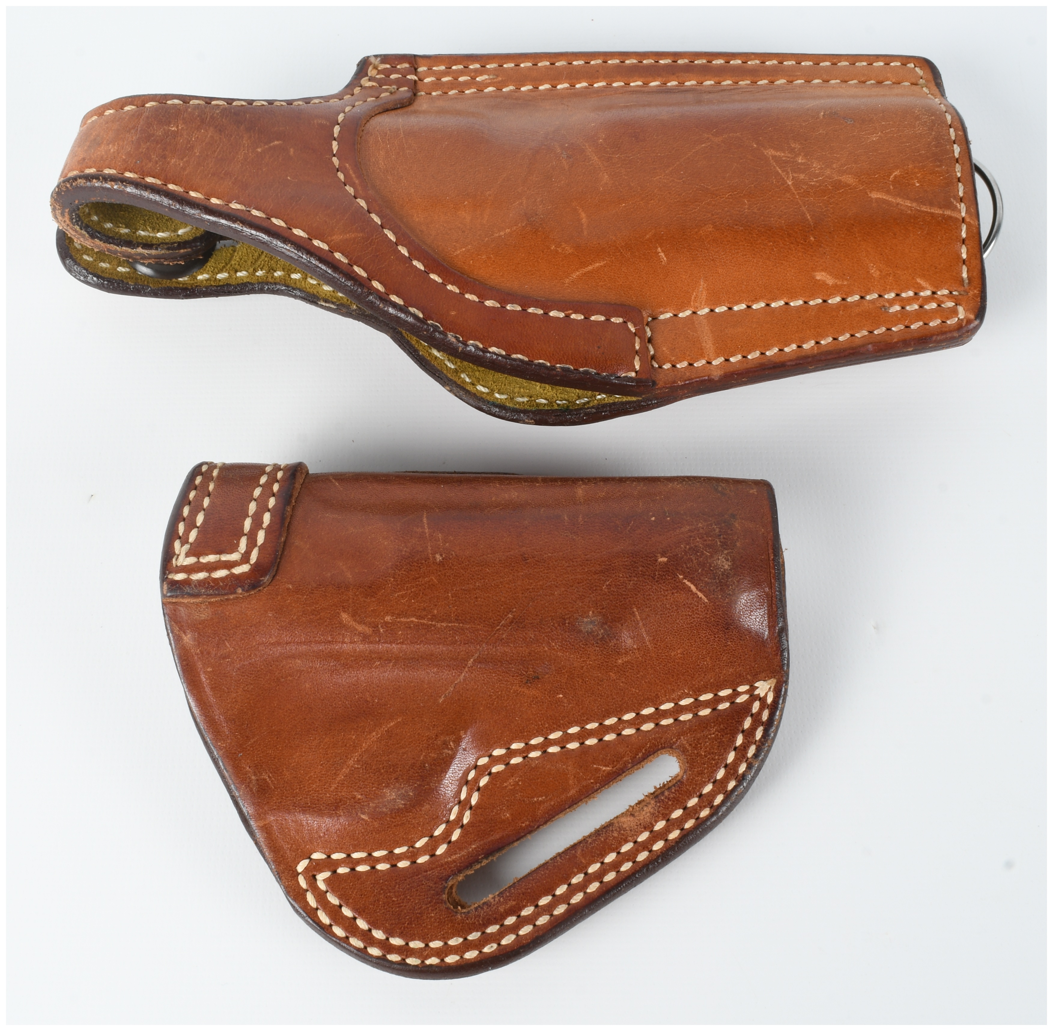 A Pair of Safariland Model 530 and Bianchi Number 4 Leather Holsters for Colt Government and Medium Auto