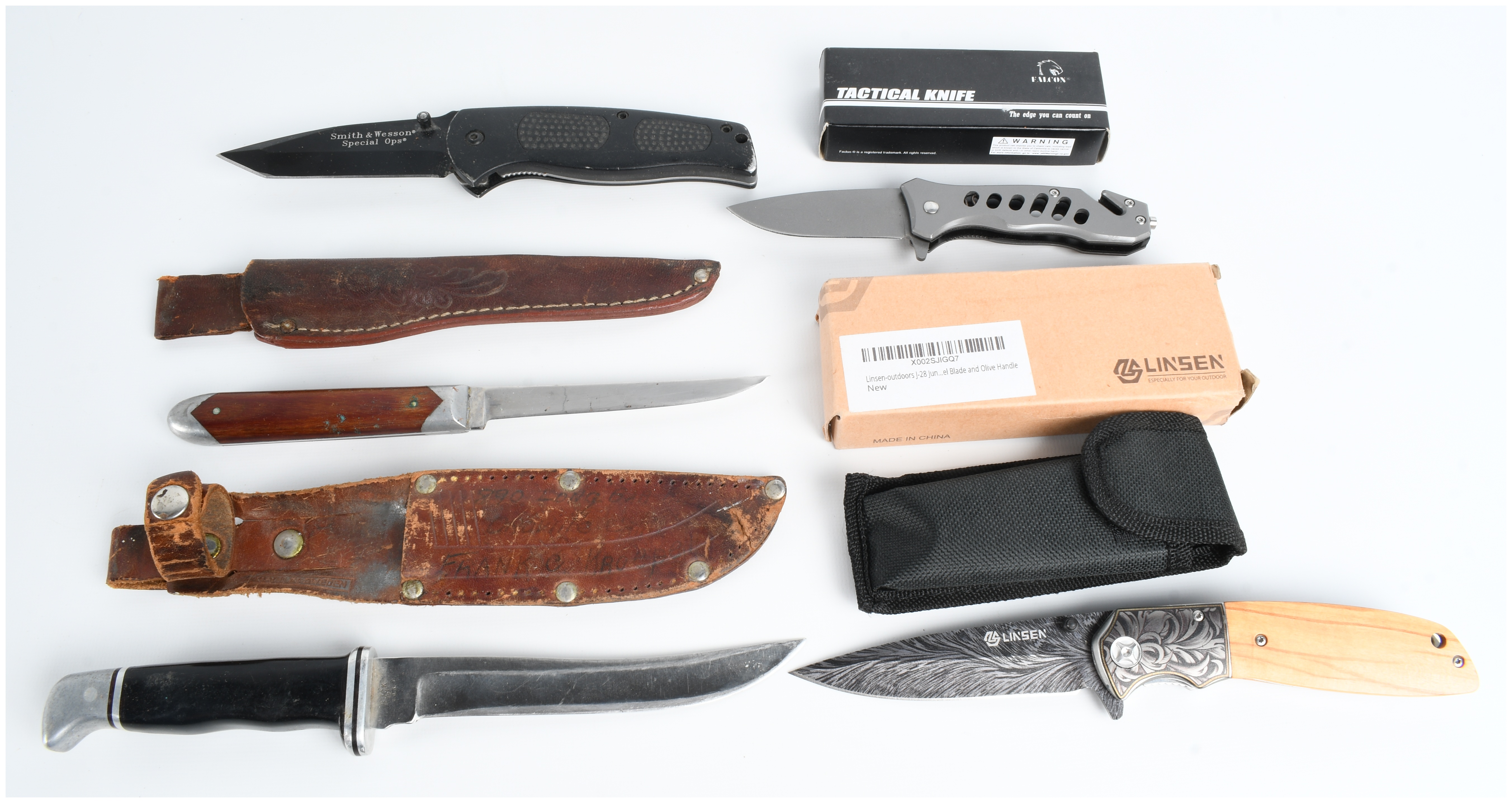 A Collection of Five Knives Including Buck and Smith & Wesson Models