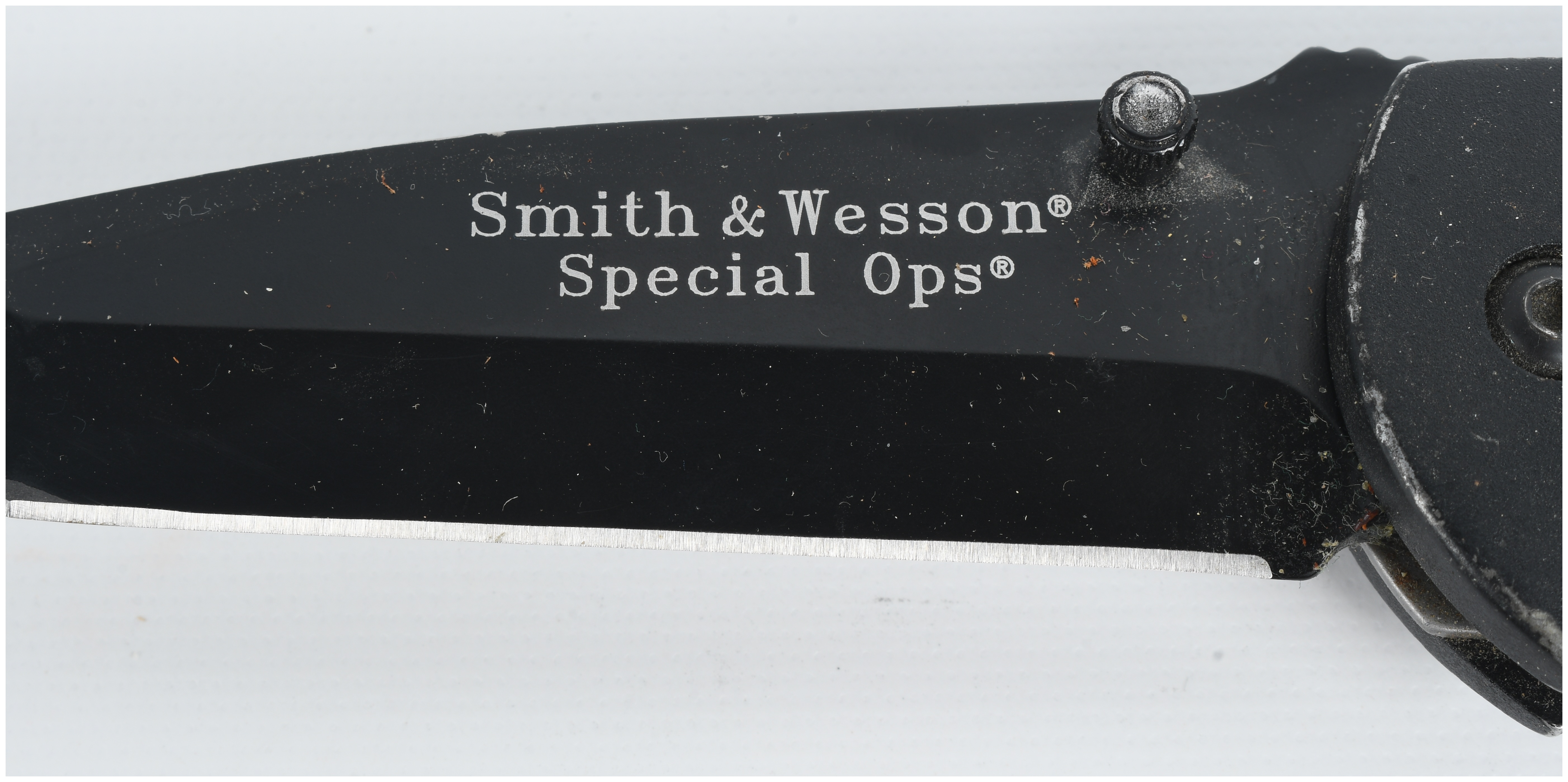 A Collection of Five Knives Including Buck and Smith & Wesson Models