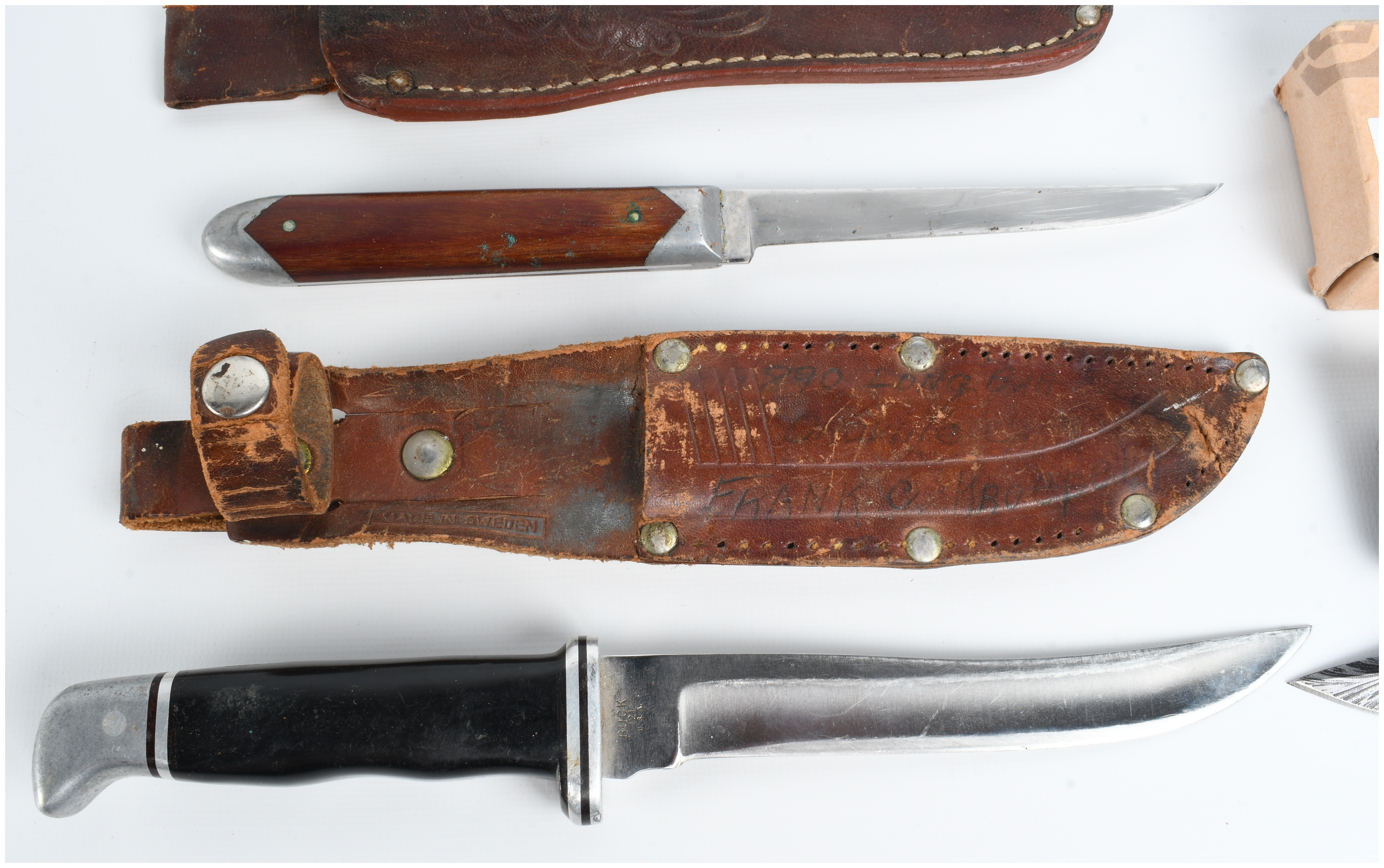 A Collection of Five Knives Including Buck and Smith & Wesson Models