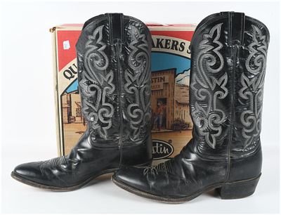 A Pair of Justin Model 1409 Men's Black Leather Western Cowboy Boots. A pair of Justin brand 