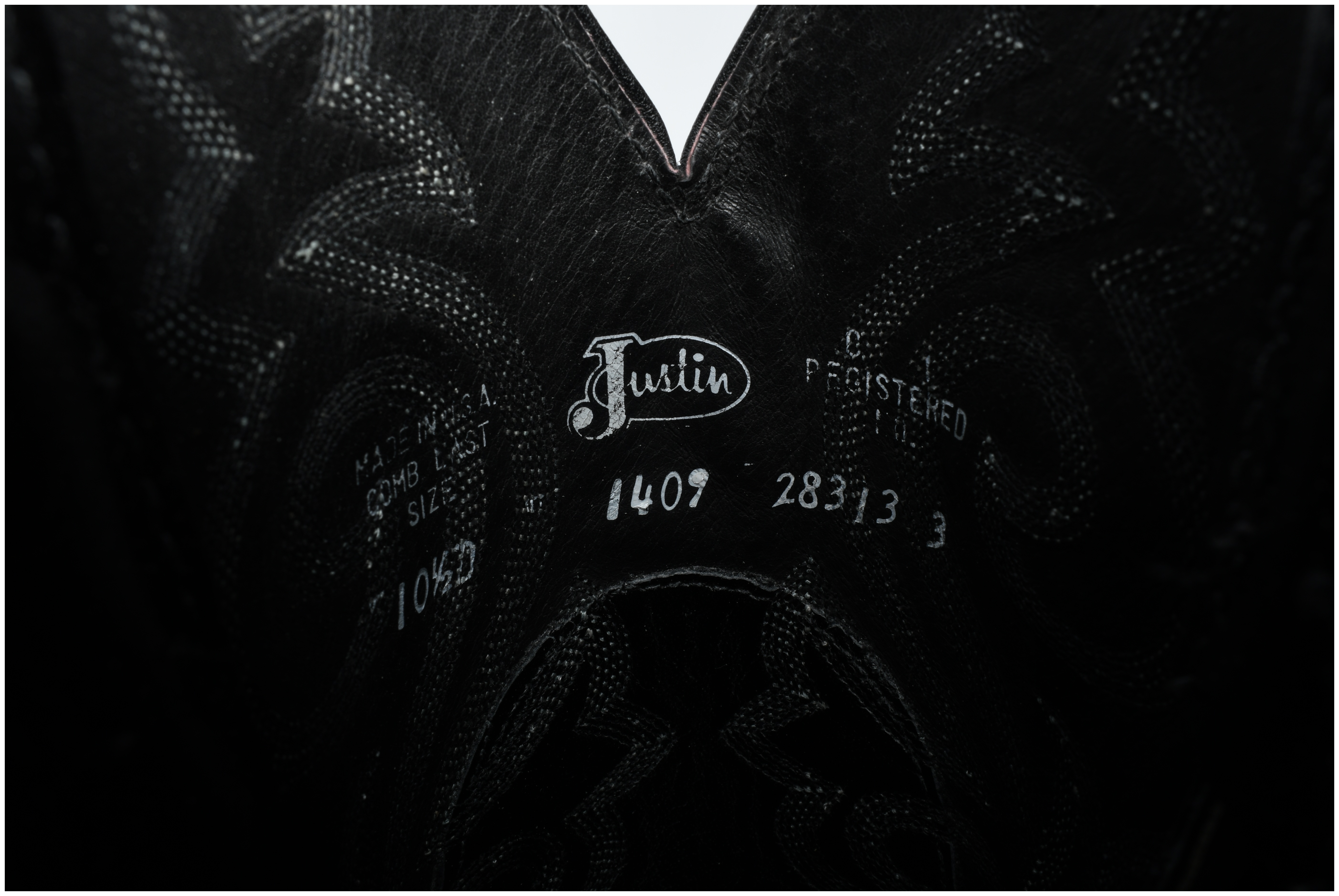 A Pair of Justin Model 1409 Men's Black Leather Western Cowboy Boots